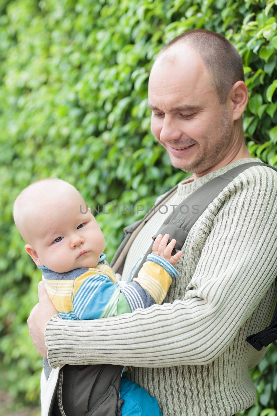 Baby and father outdoor portrait