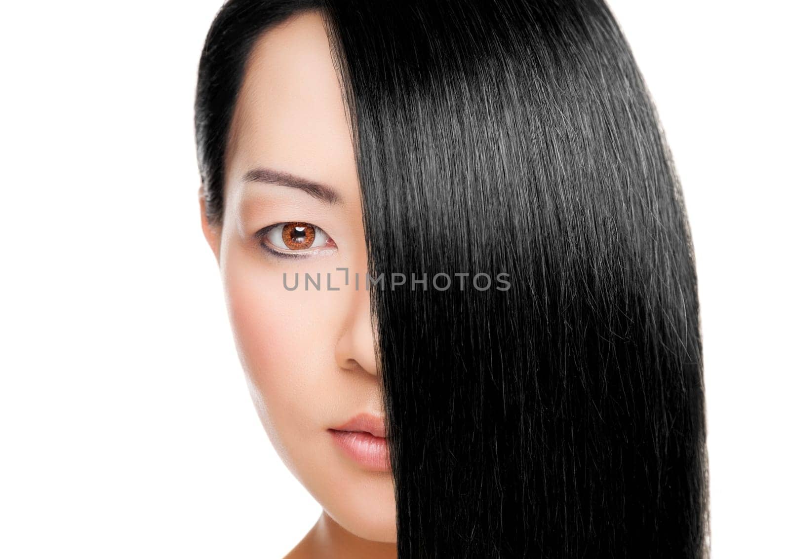 Beautiful young Thai woman with long elegant straight hair
