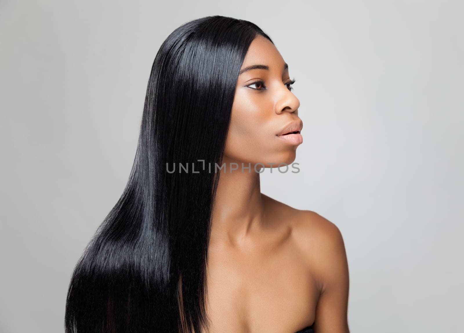 Beautiful young black woman with long straight hair