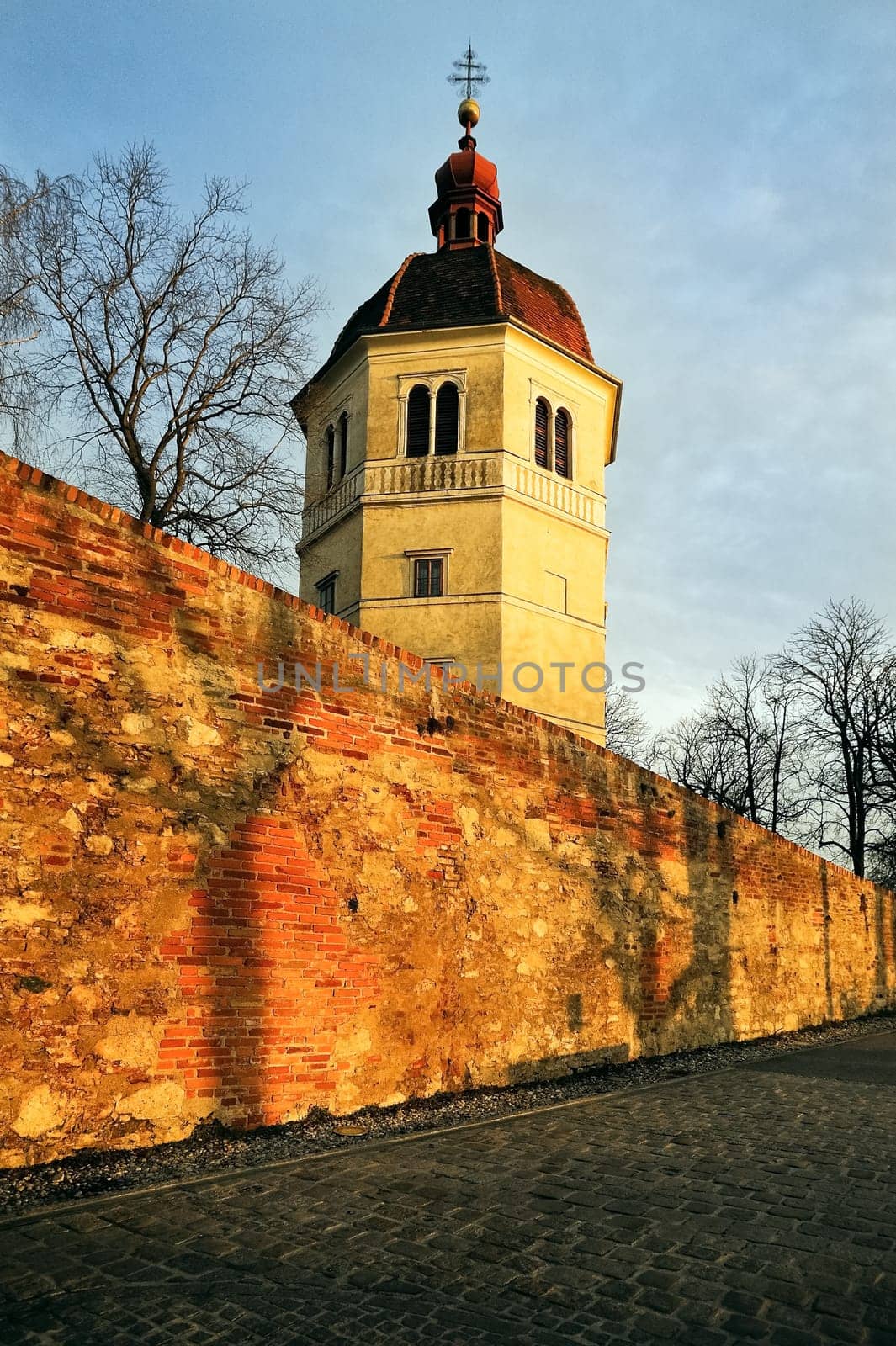 Bell tower in Graz with wall of the bastion in the foreground