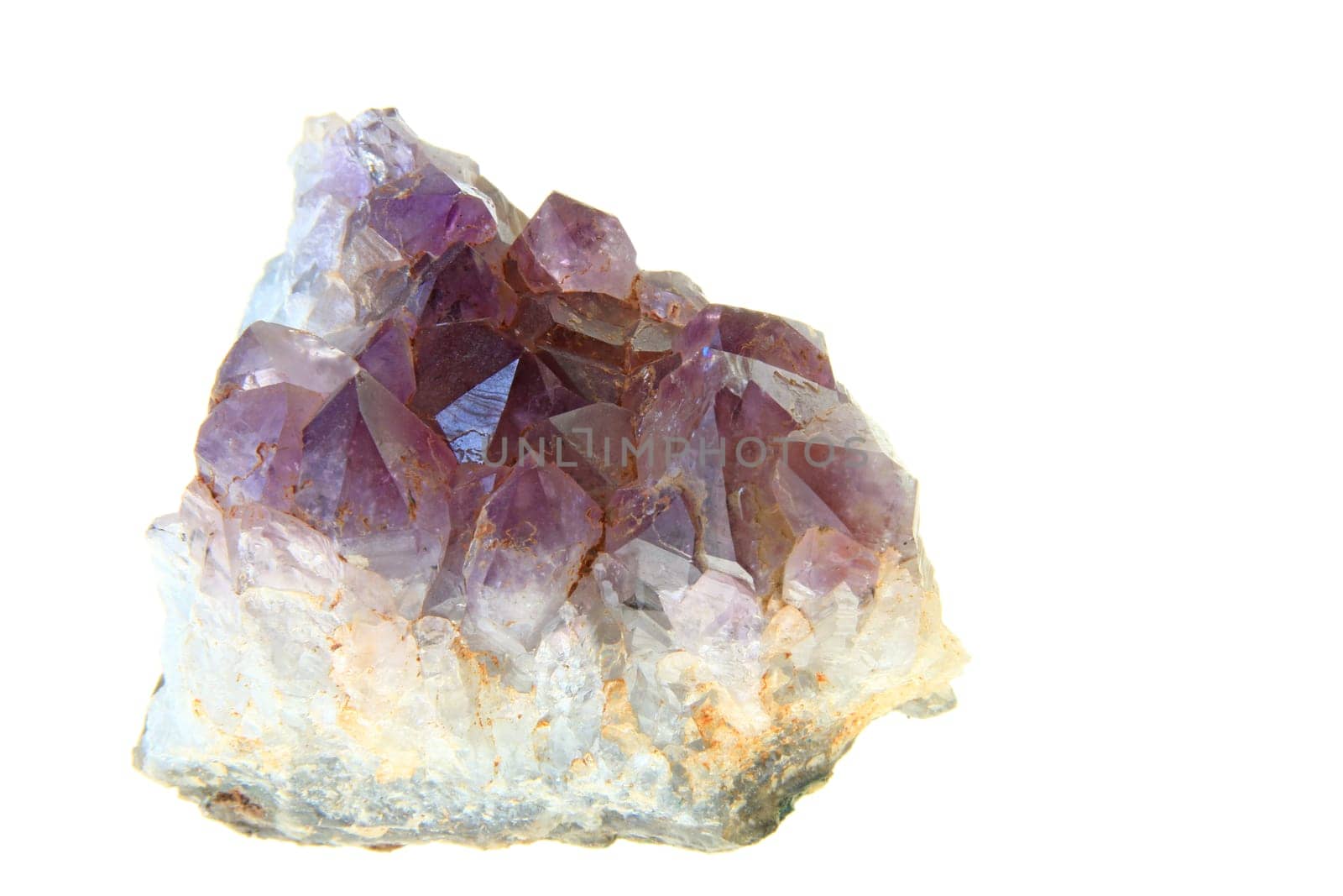 Amethyst crystals against a white background