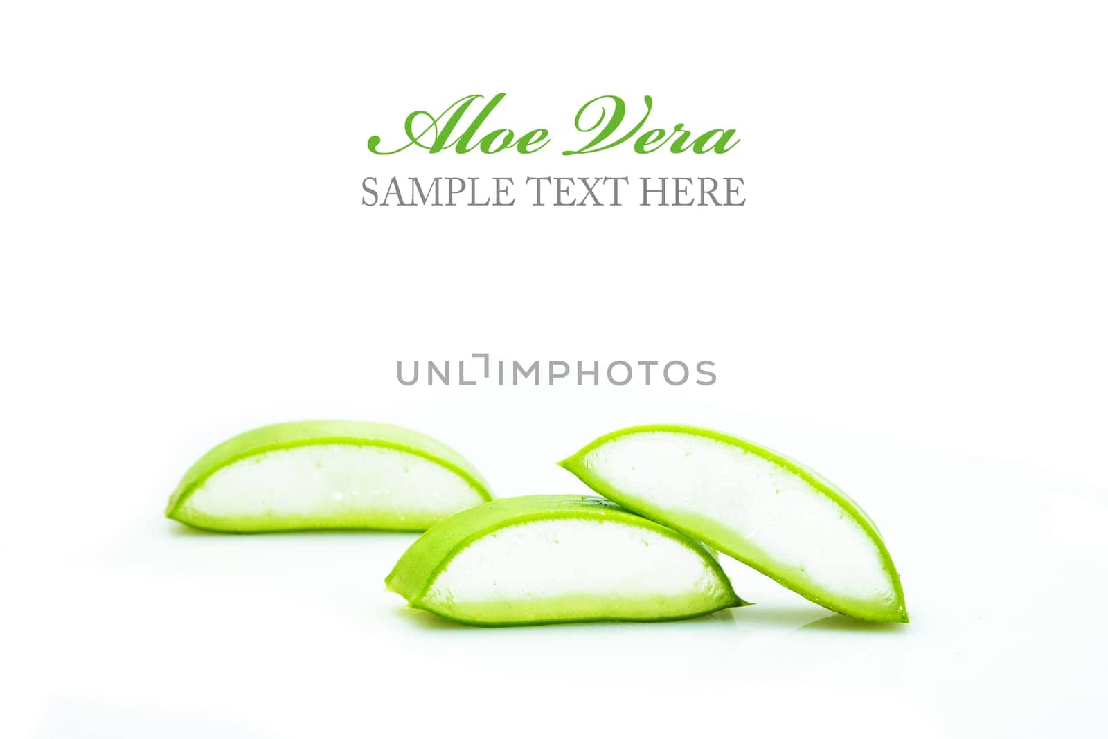 Woman's hand dropping a drop from a leaf of aloe vera in a bottle