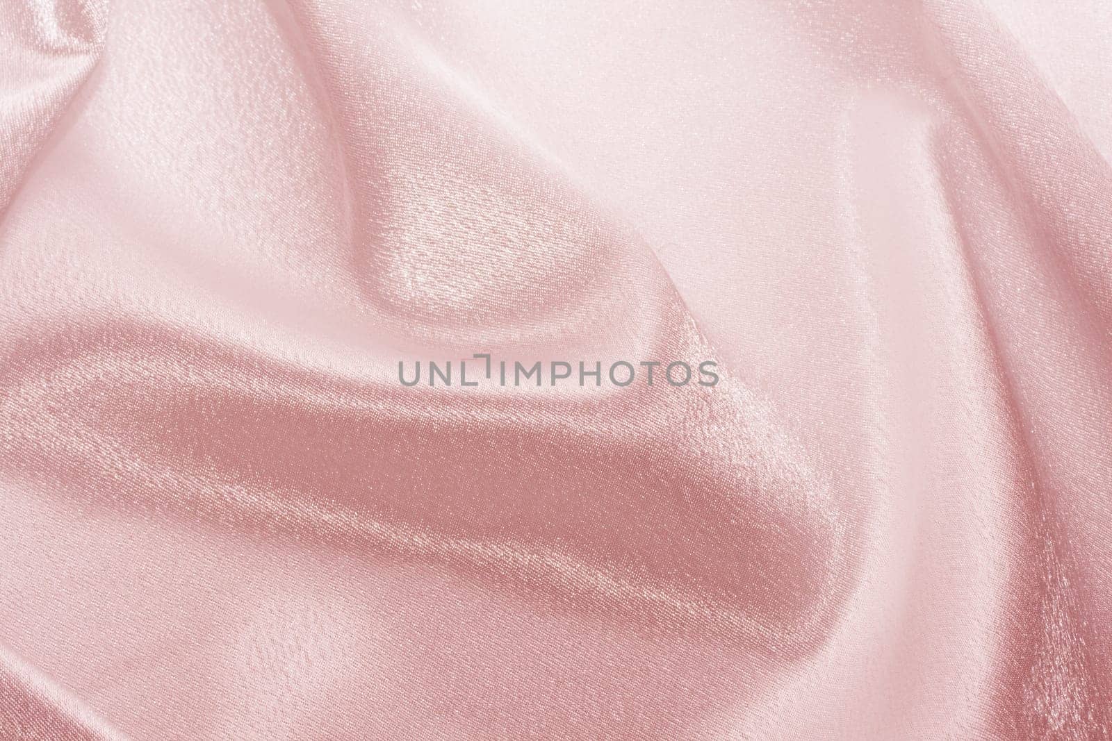 Abstract background pink silk fabric with beautiful waves