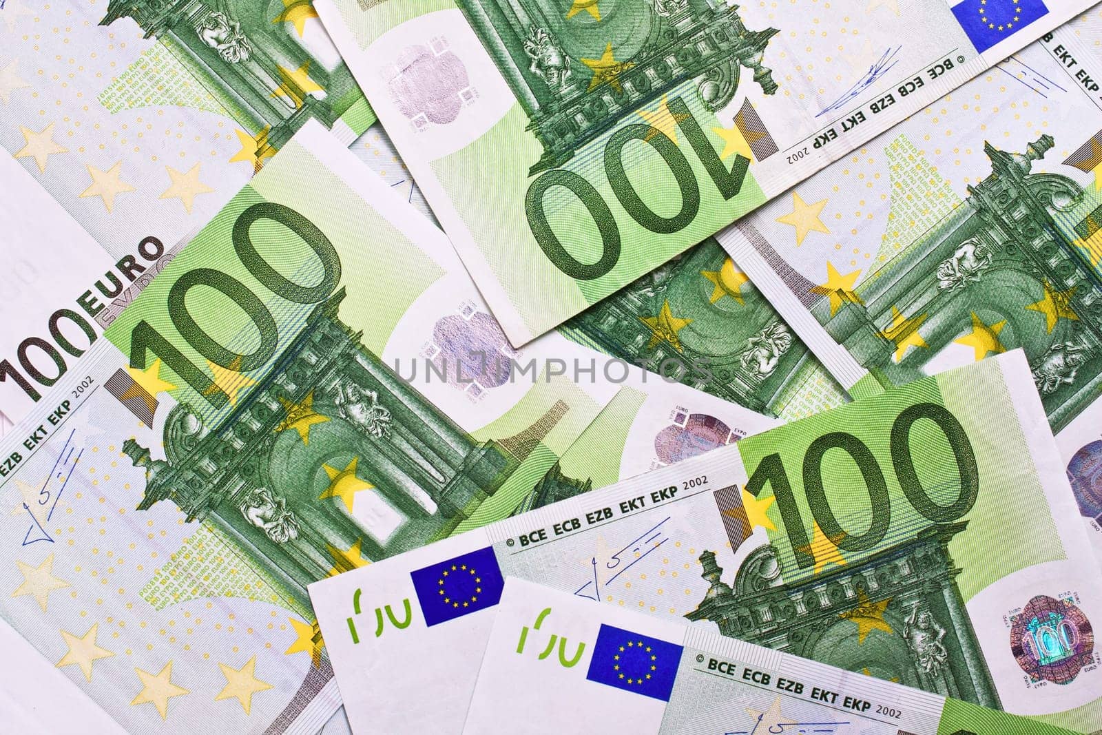 Many euro banknotes making european currency background