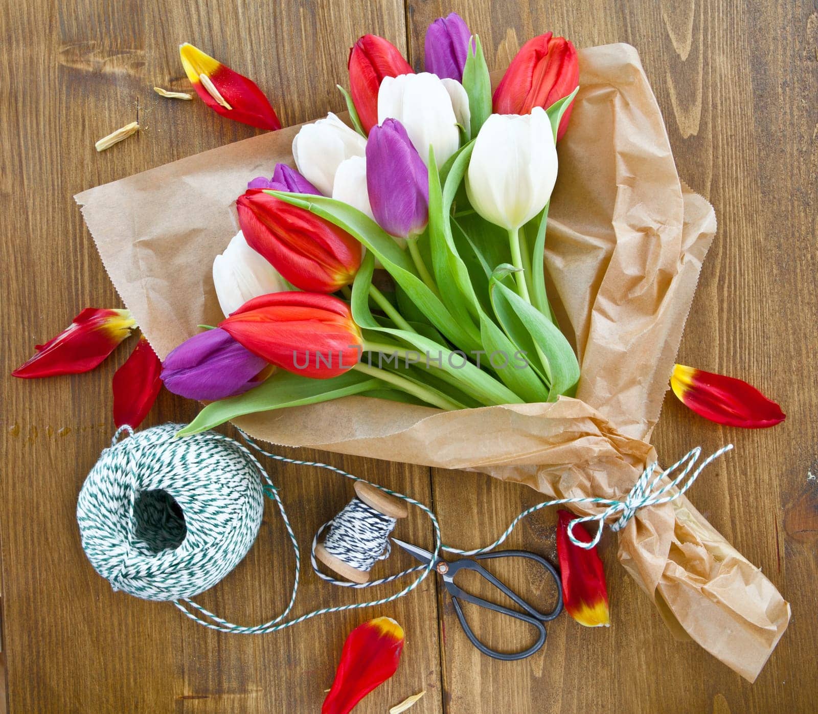 Colourful bouquet of tulips on rustic wood