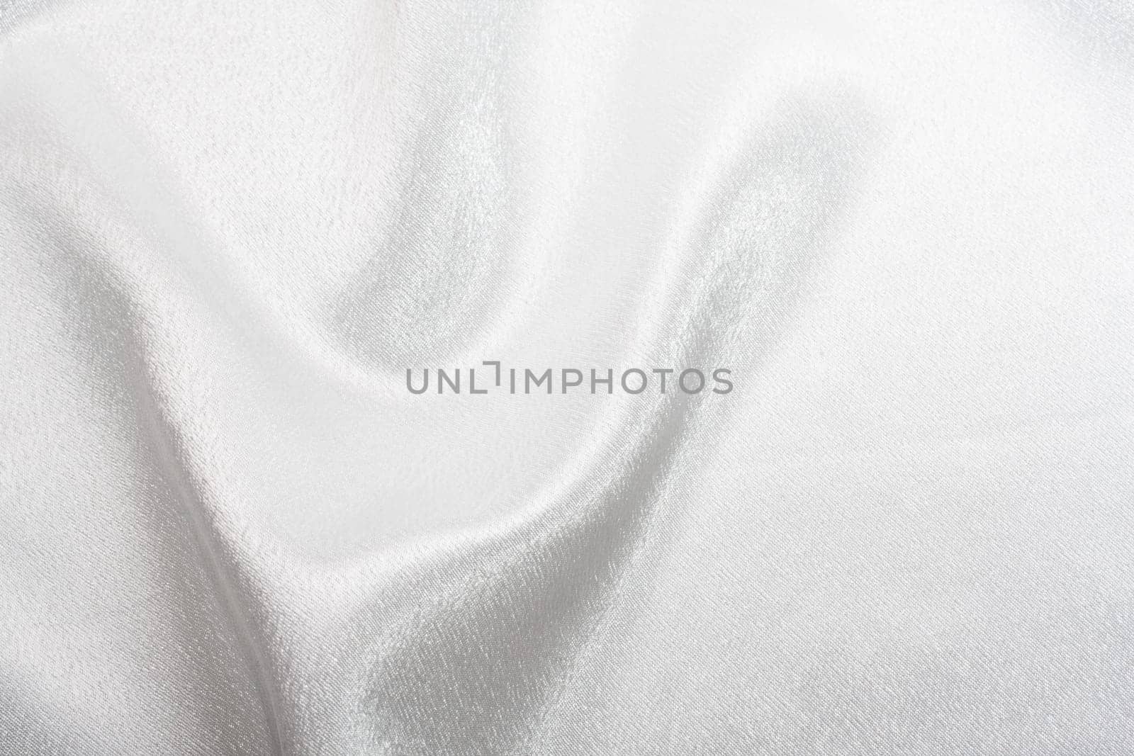 Abstract background white silk fabric with beautiful waves