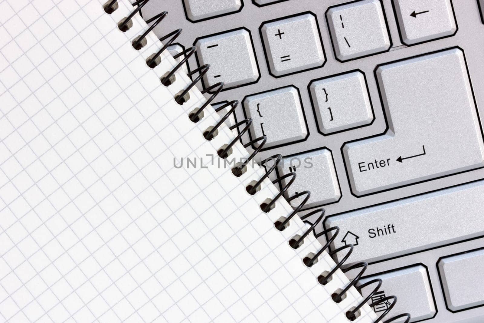 Notebook  on the computer keyboard. Close up view .