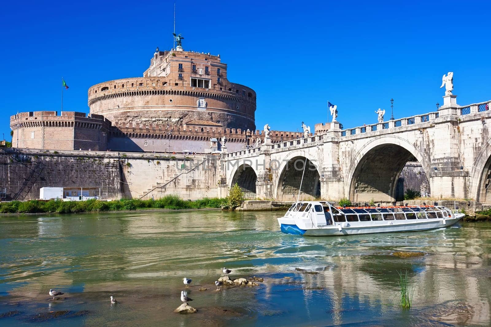 Famous Saint Angel castle and bridge over Tiber river in Rome, Italy