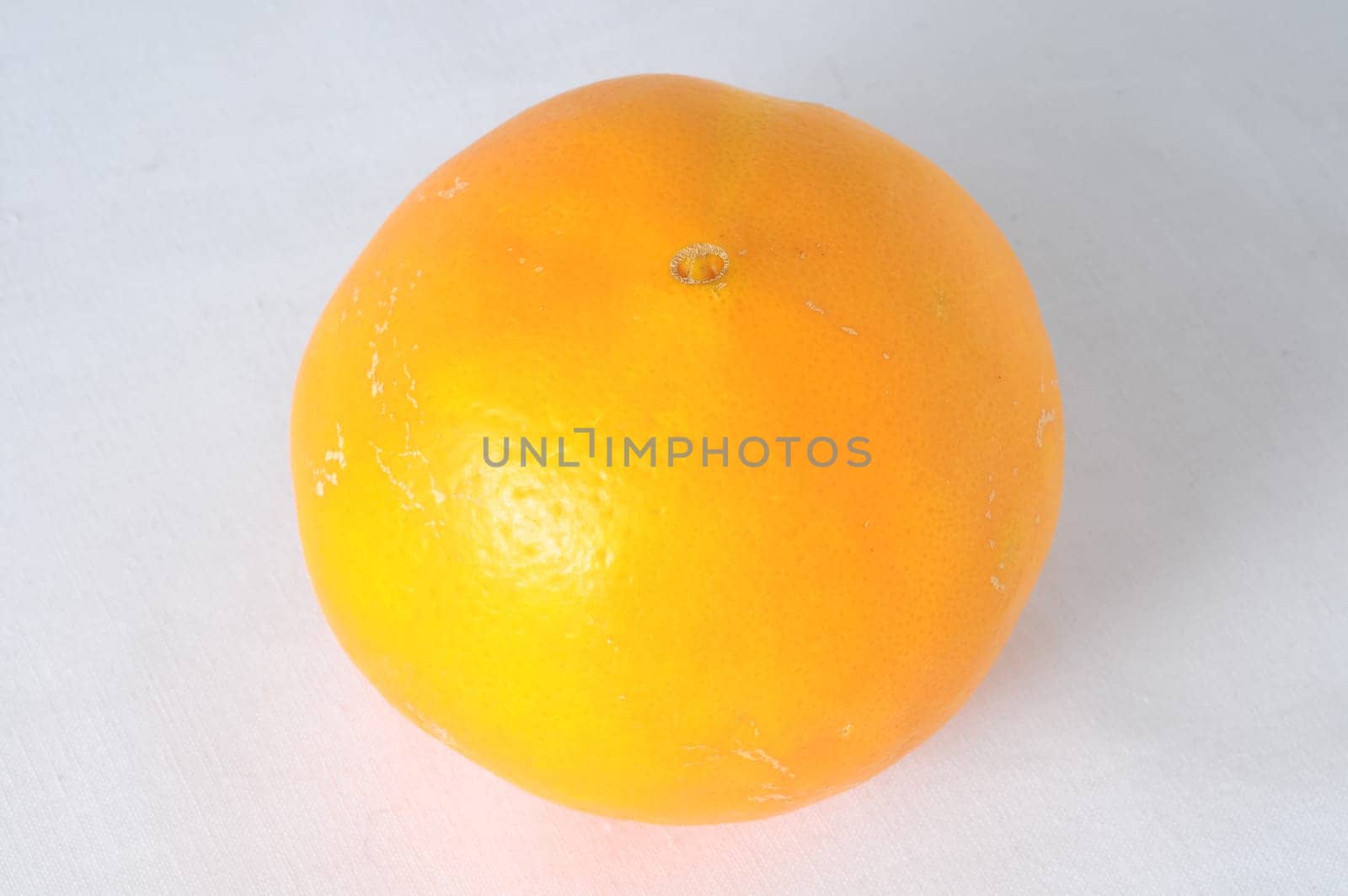 Very Ripe Healthy Orange on a White Background