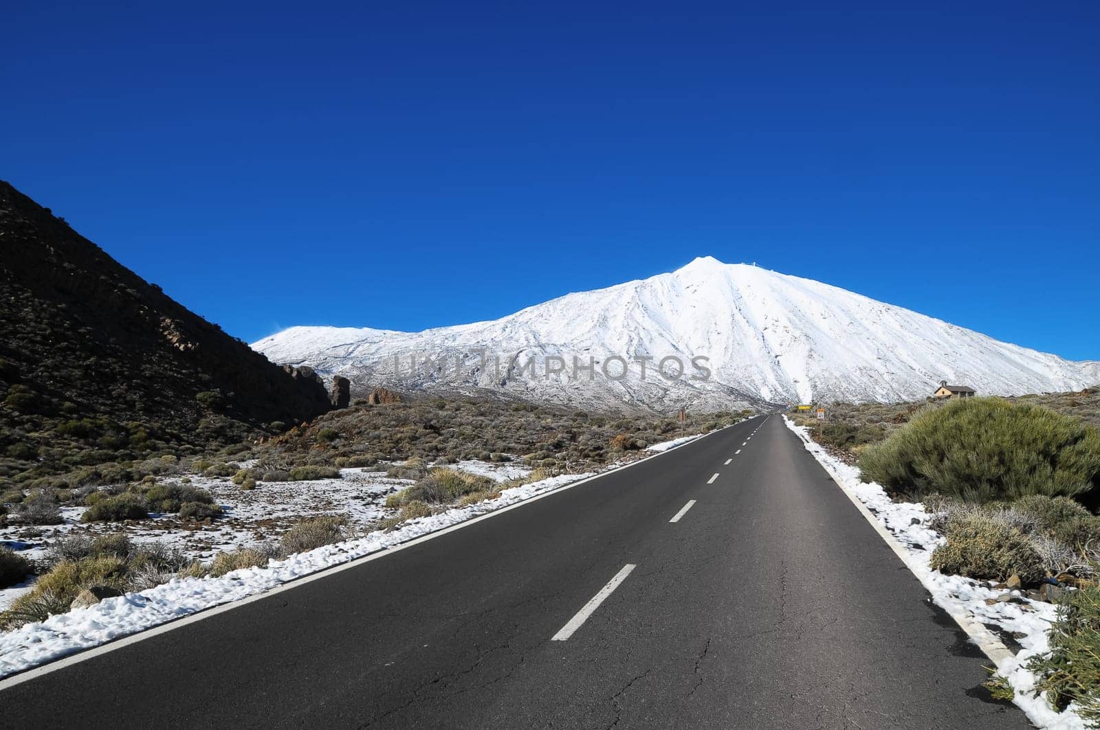 Snow Desert Lonely Road Landscape in Volcan Teide National Park, Tenerife, Canary Island, Spain