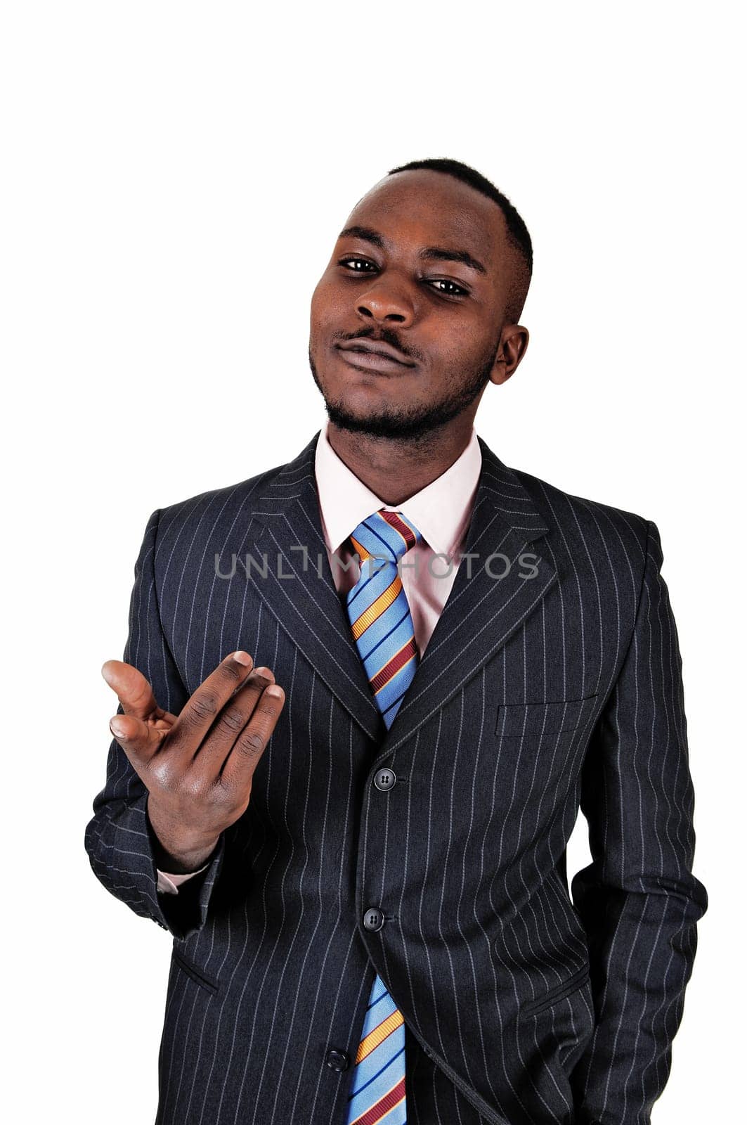 A young black business man standing in a suit and tie, gesturing with.his hands for white background..