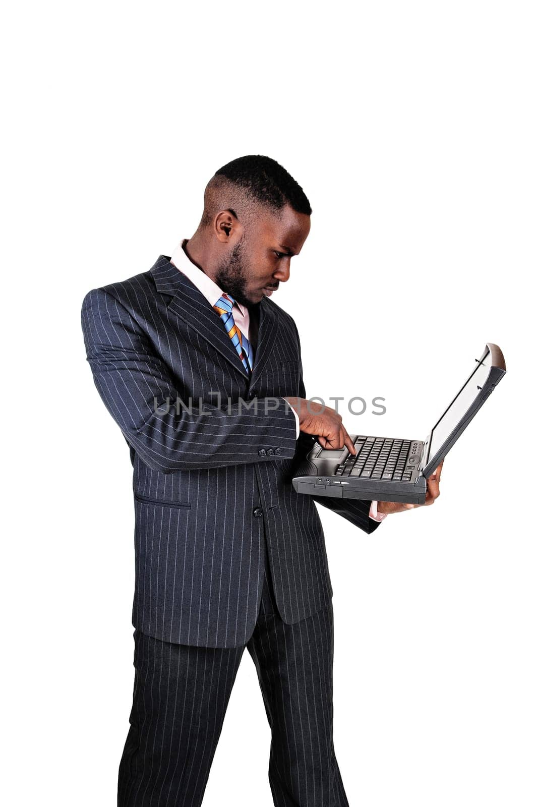 A black businessman holding his laptop in his hands, for white background..