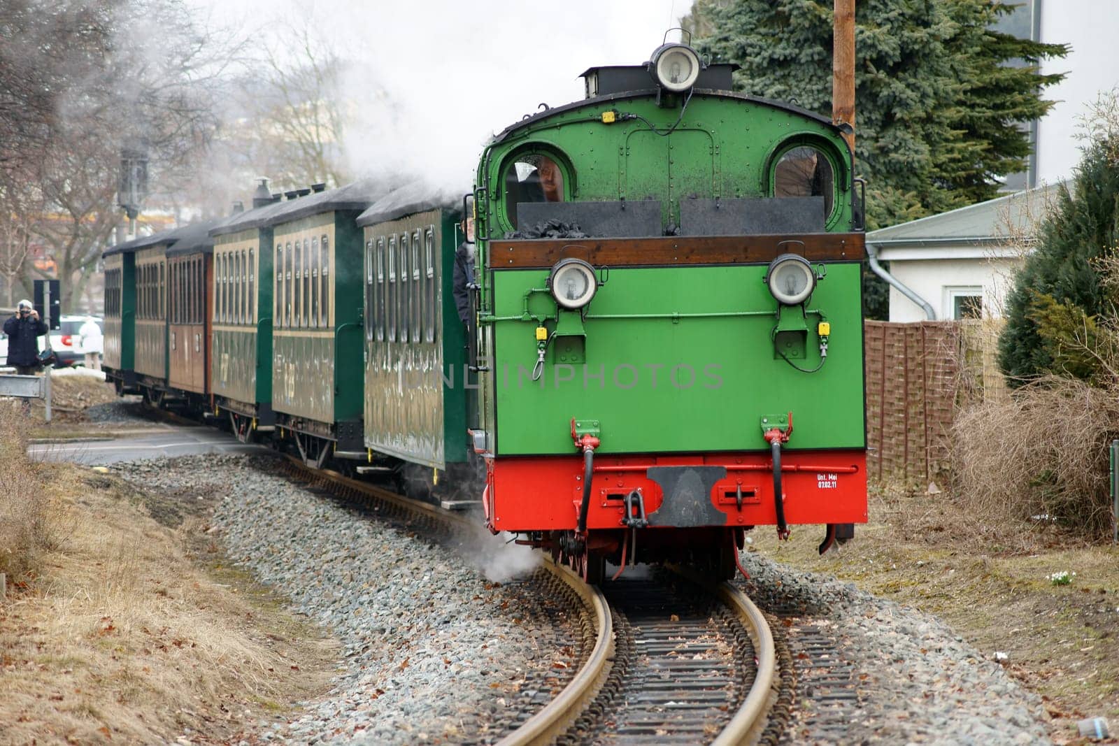Binz,Germany – April 05,2013: A tourist photographs the Rügen spa railway "Rasender Roland"" on April 5,2013 on the island of Rügen."