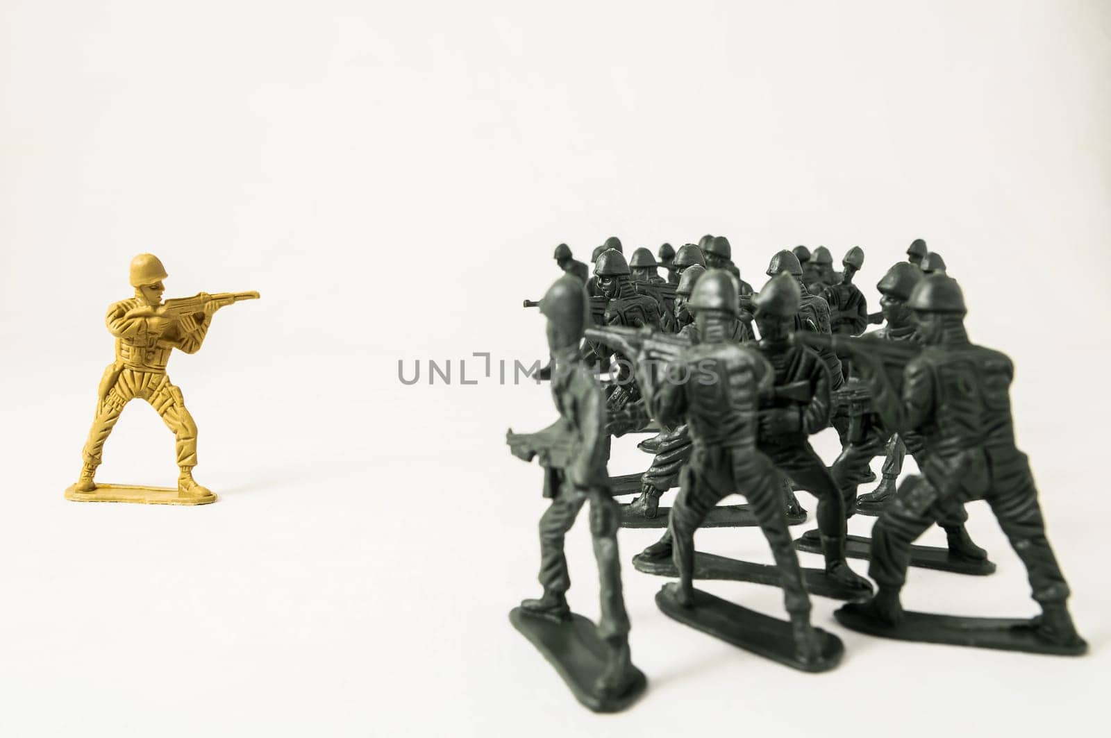 Plastic Lead Soldiers Representing War on a White Background