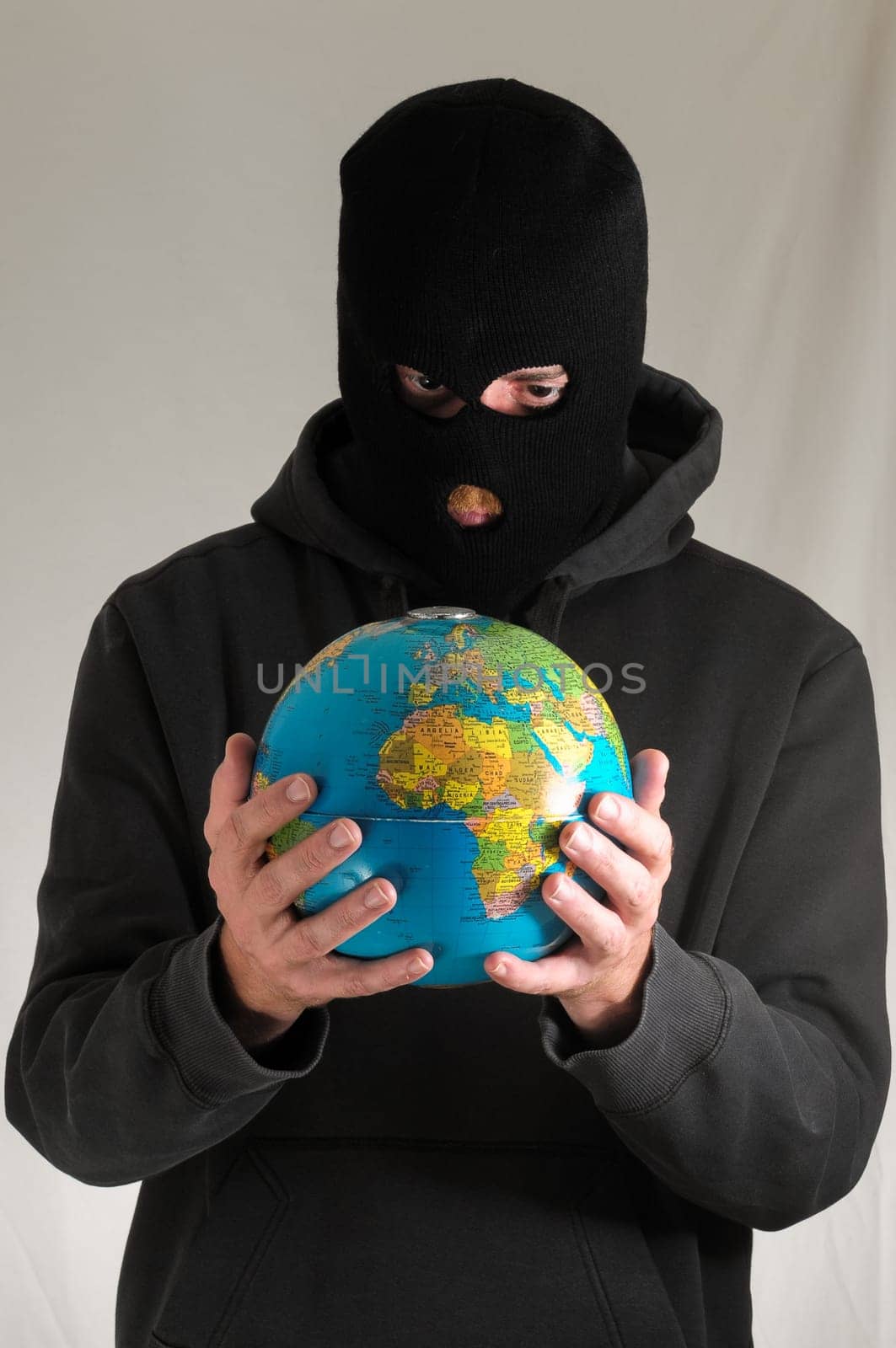 Black Dressed Young Man Holding a Globe Earth
