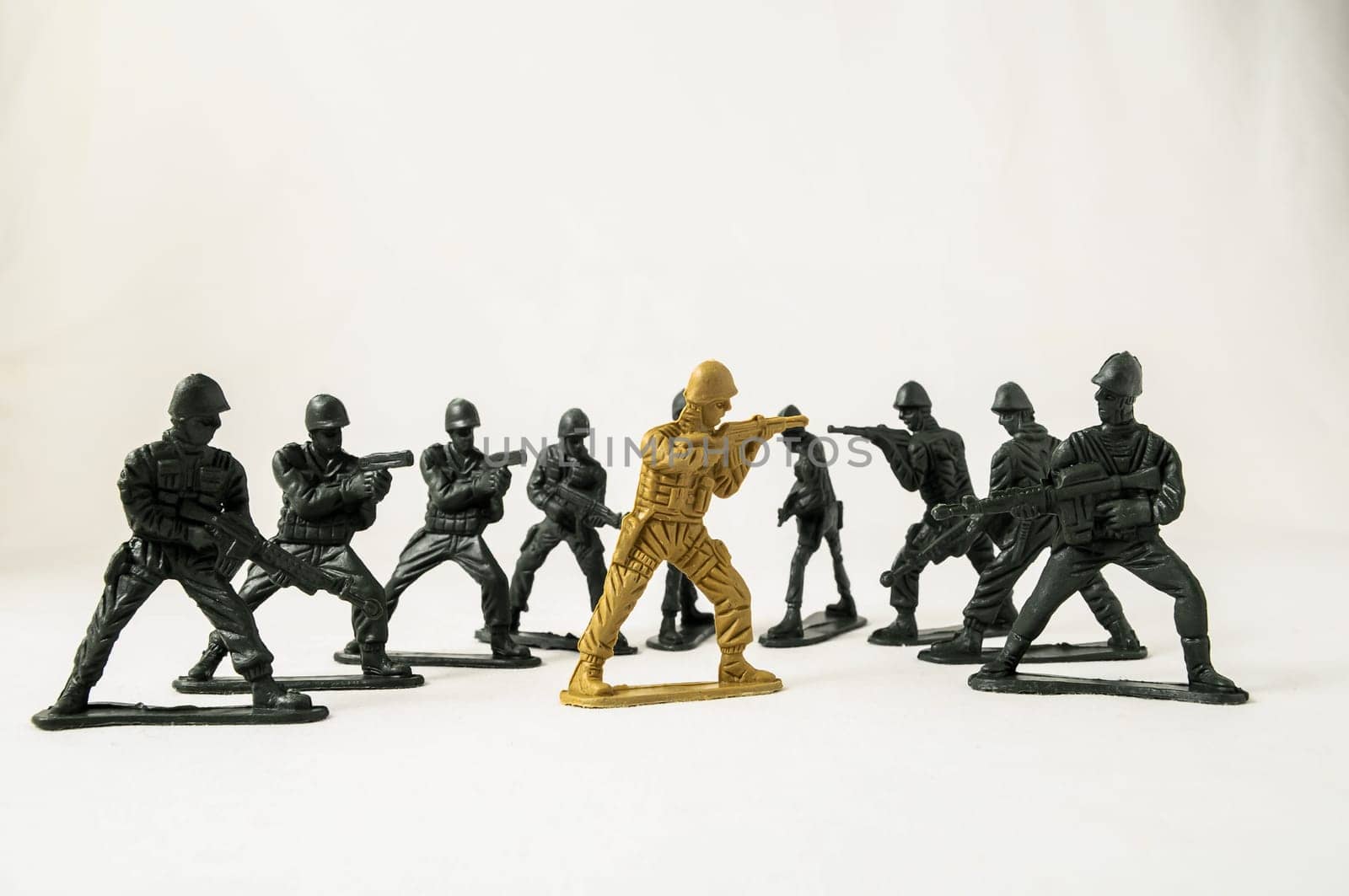 Plastic Lead Soldiers Representing War on a White Background