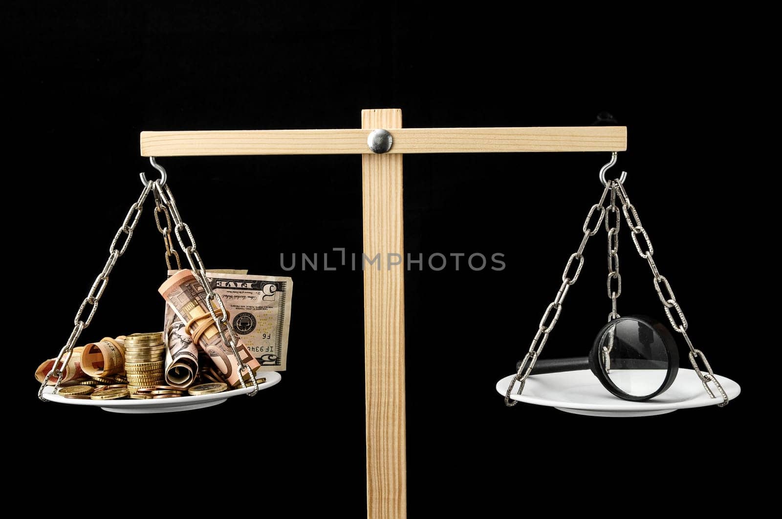 Money and Loupe on a Two Plan Balance Search Concept