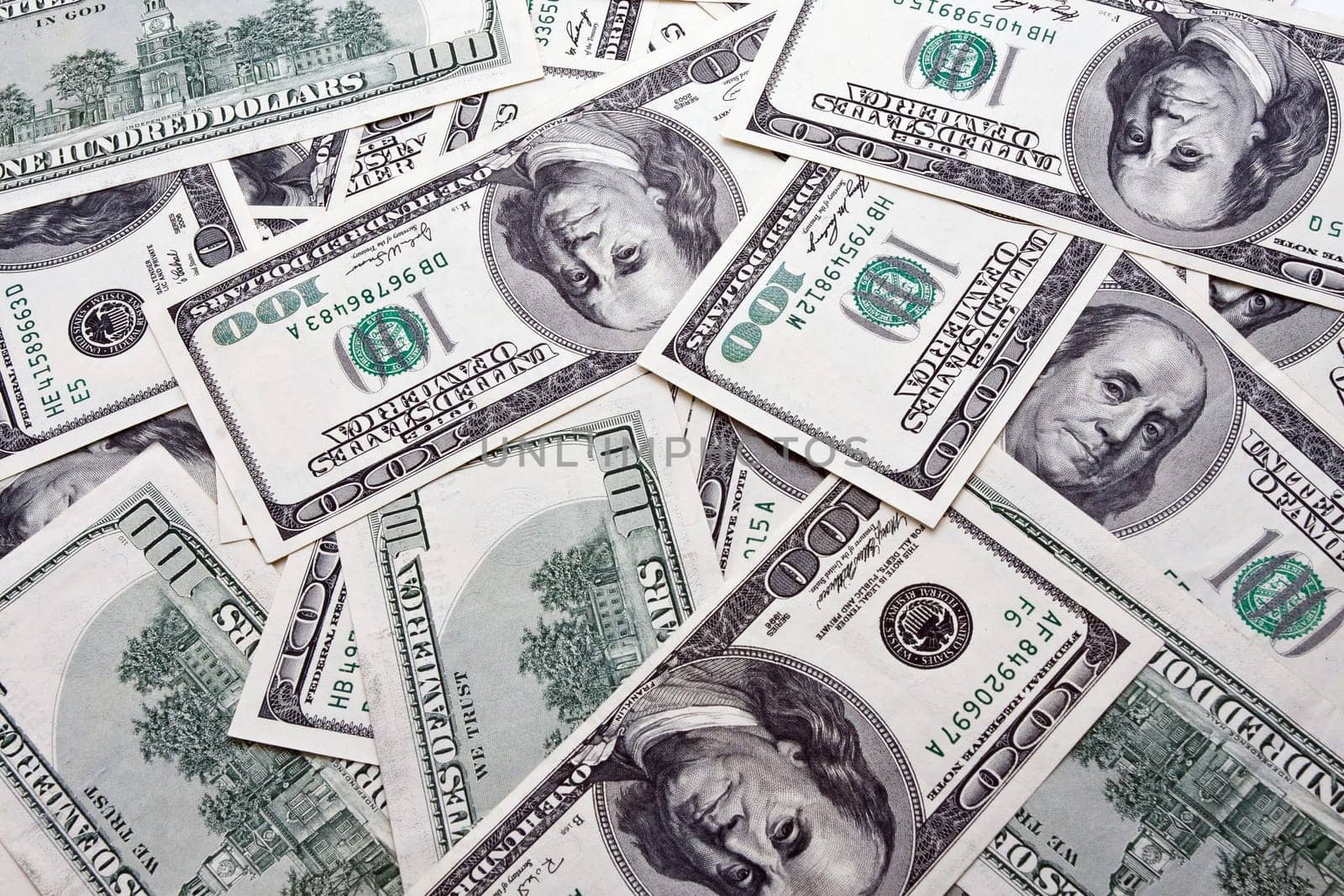 Lots of dollar notes arranged in chaotic manner, background