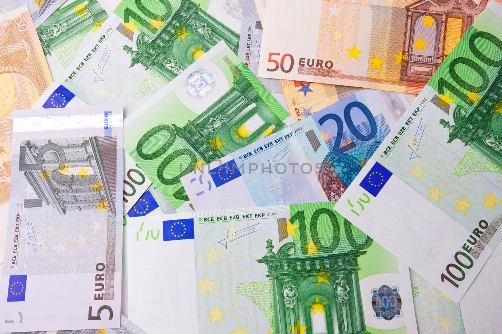 Many euro banknotes making european currency background