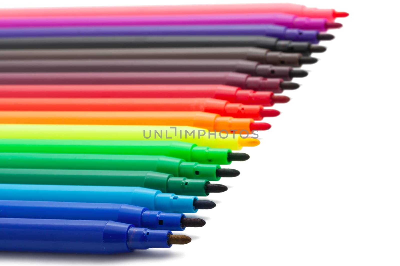Group of felt tip bright color markers on white background
