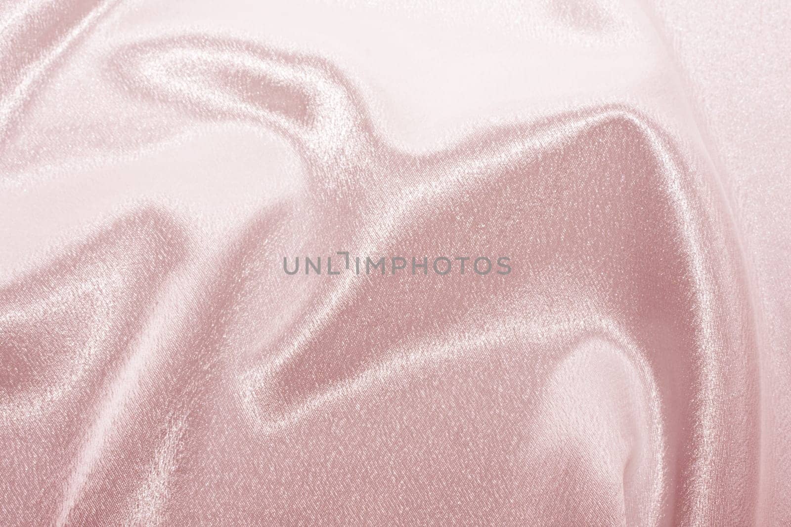 Abstract background pink silk fabric with beautiful waves