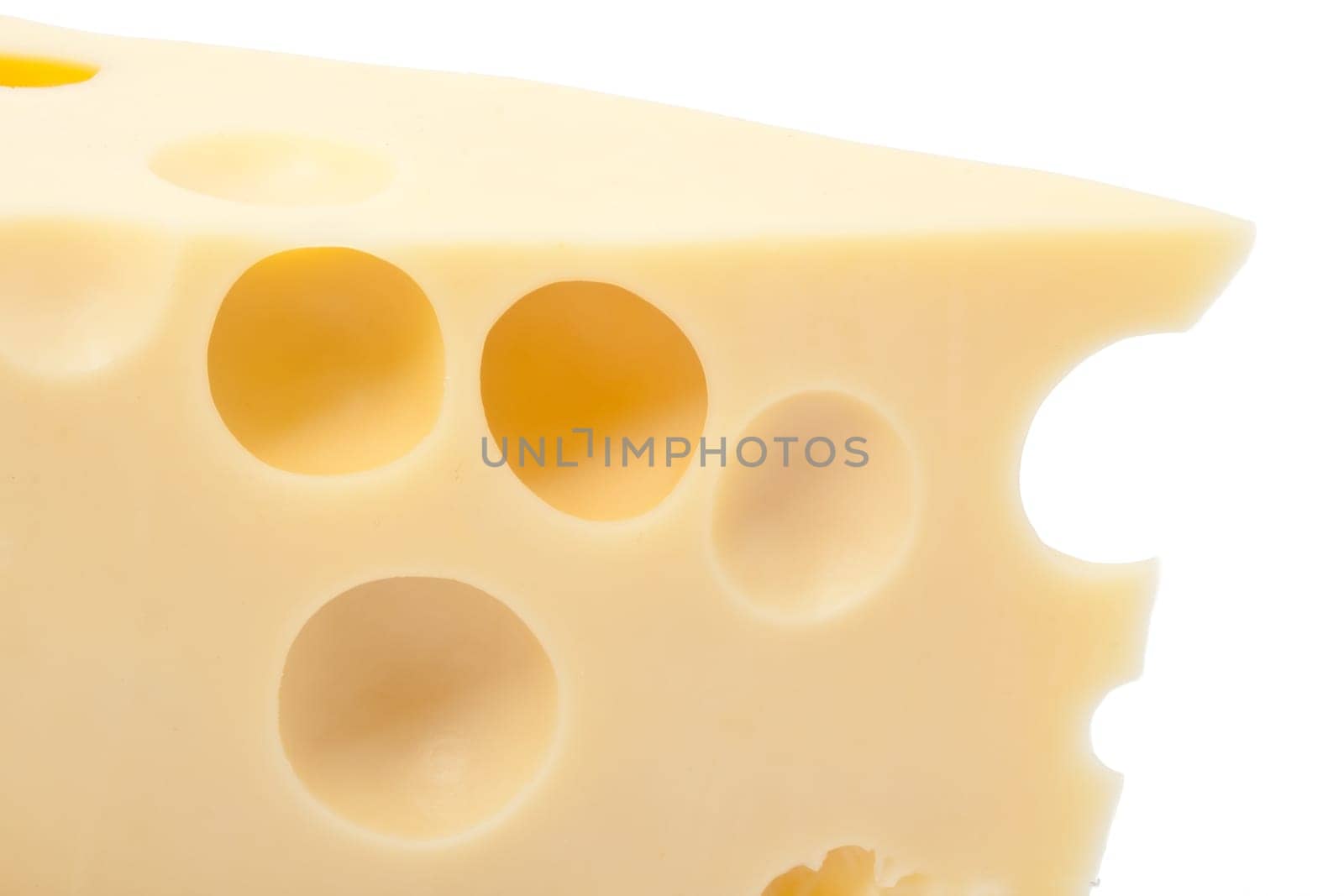 Piece of yellow cheese with holes, isolated on white background