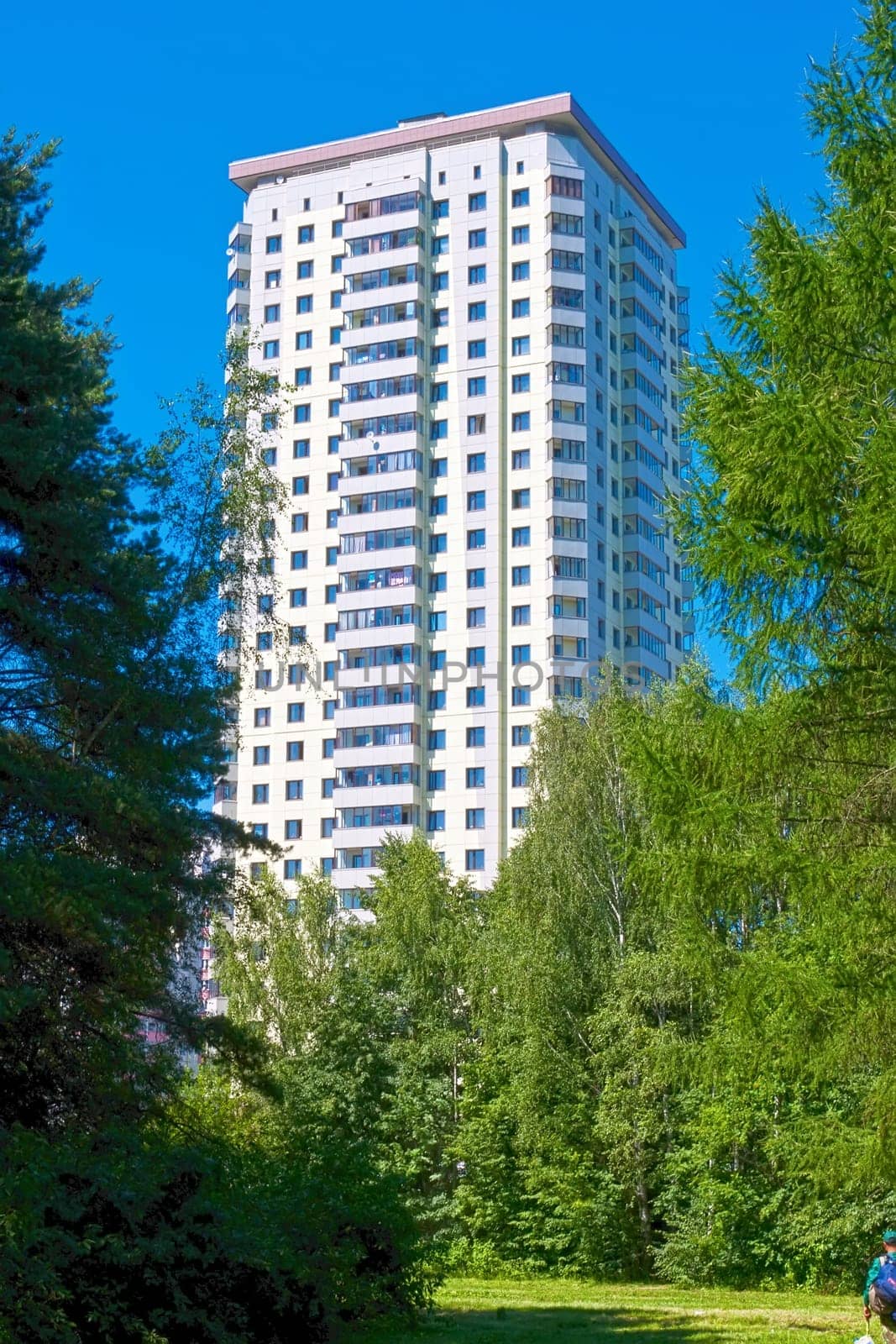 Beautiful view of modern apartment building under blue sky