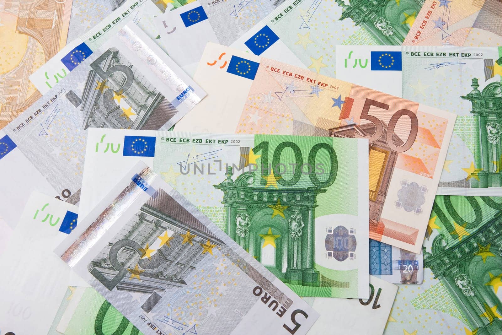 Many euro banknotes making european currency background