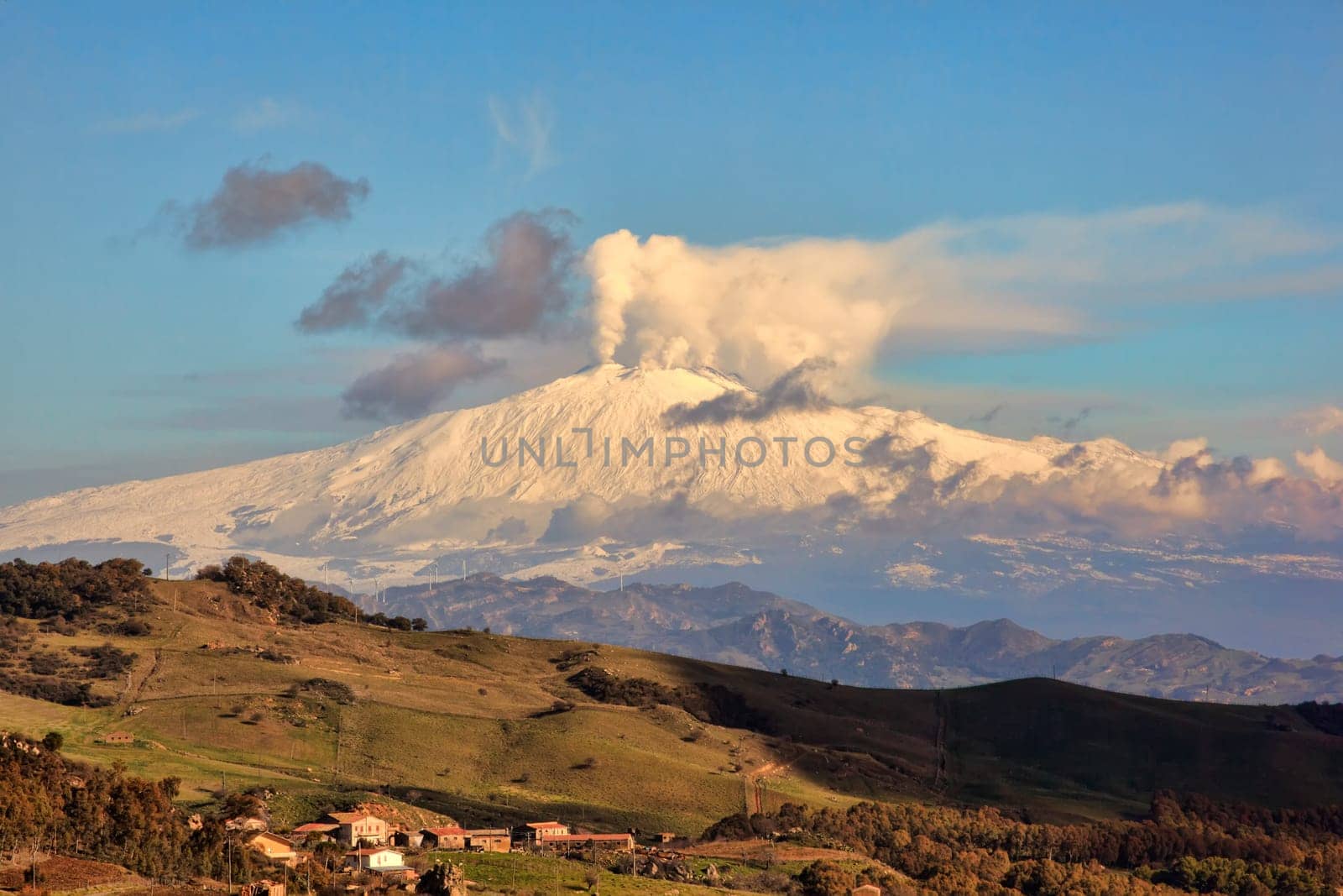 View from Altesina montain of volcano Etna and column of smoke