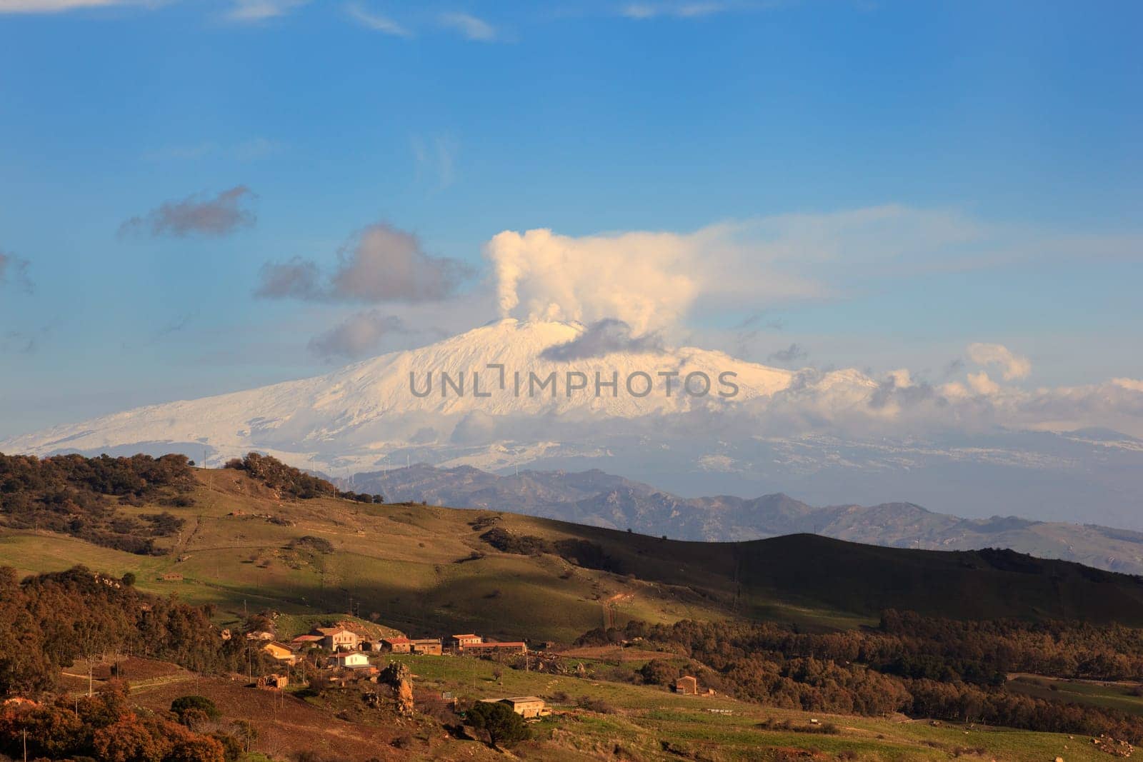 View from Altesina montain of volcano Etna and column of smoke