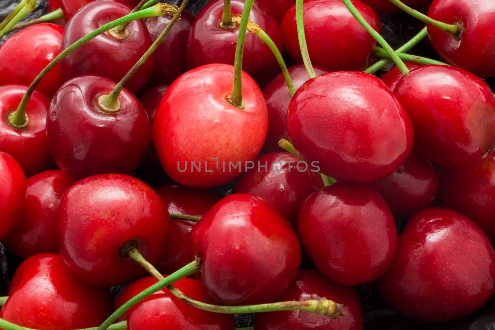 Beautiful red fresh cherry macro photo background
