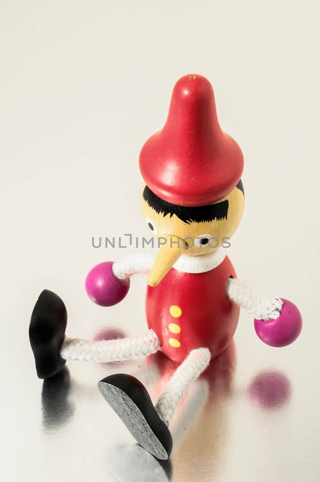 Pinocchio Toy Statue on a Colored Background