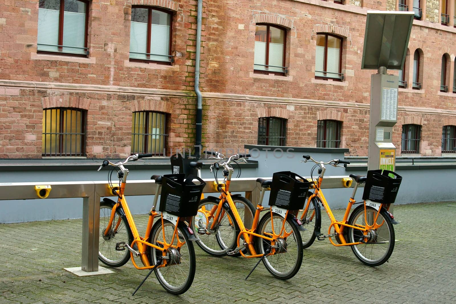 Mainz,Germany – January 21,2014: Bicycles stand one behind the other at a station of "MVGmeinRad"" of the Mainzer Verkehrsgesellschaft on January 21,2014 in Mainz."