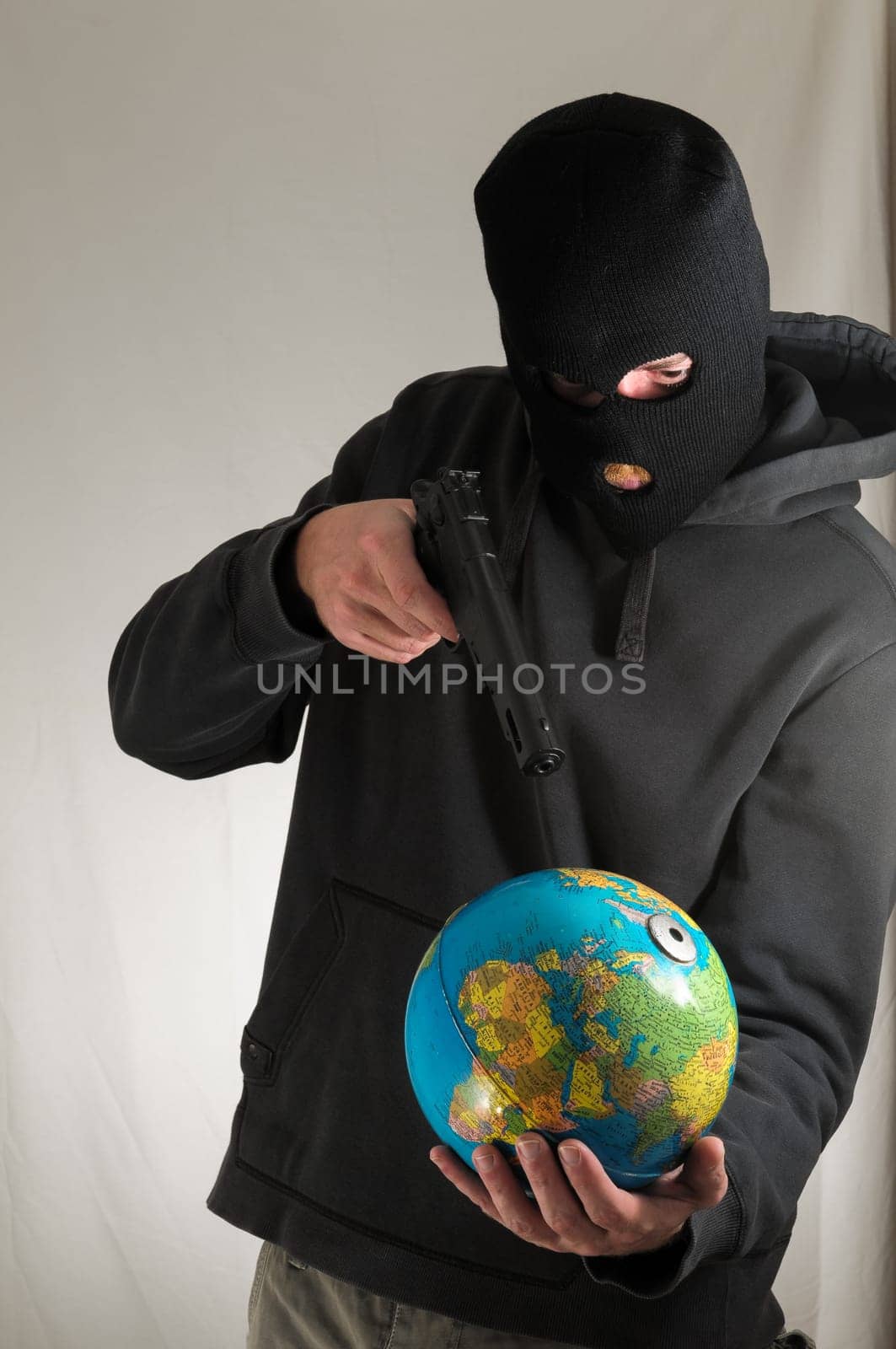 Black Dressed Young Man Holding a Globe Earth