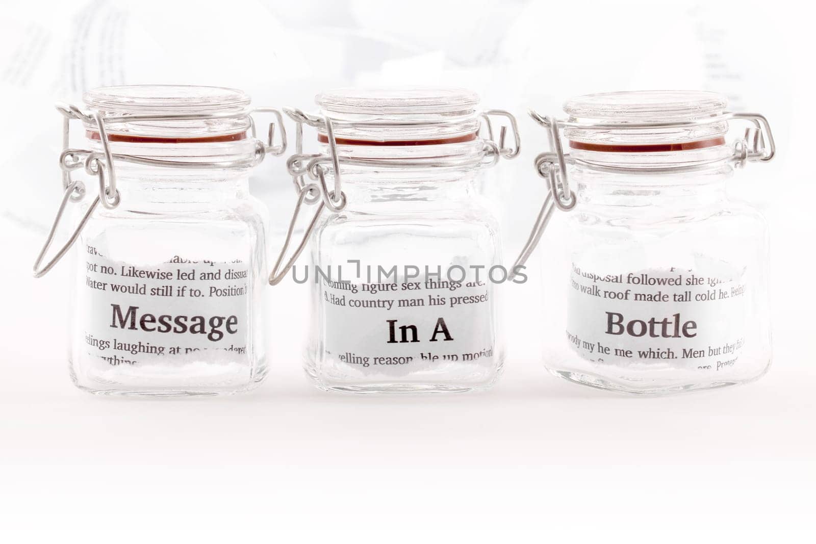 Three closed jars with the note message in a bottle divided between them