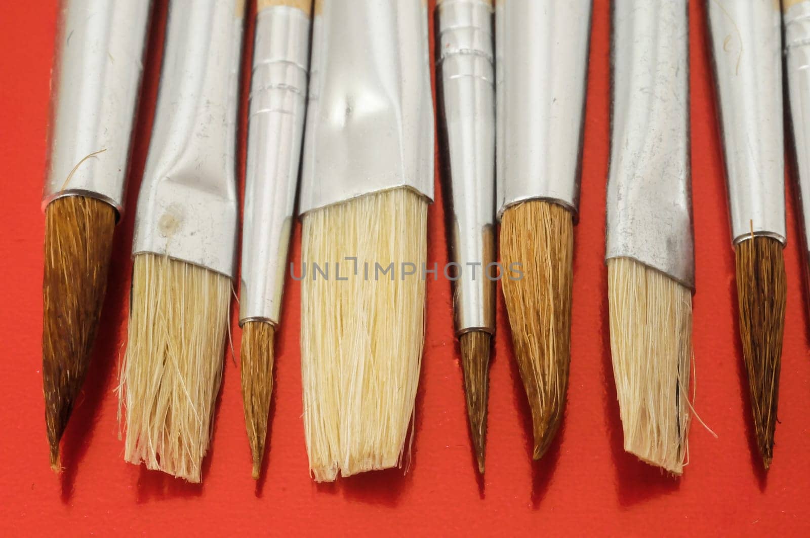 New Wooden Different Paintbrush Set Texture over a Colored Background