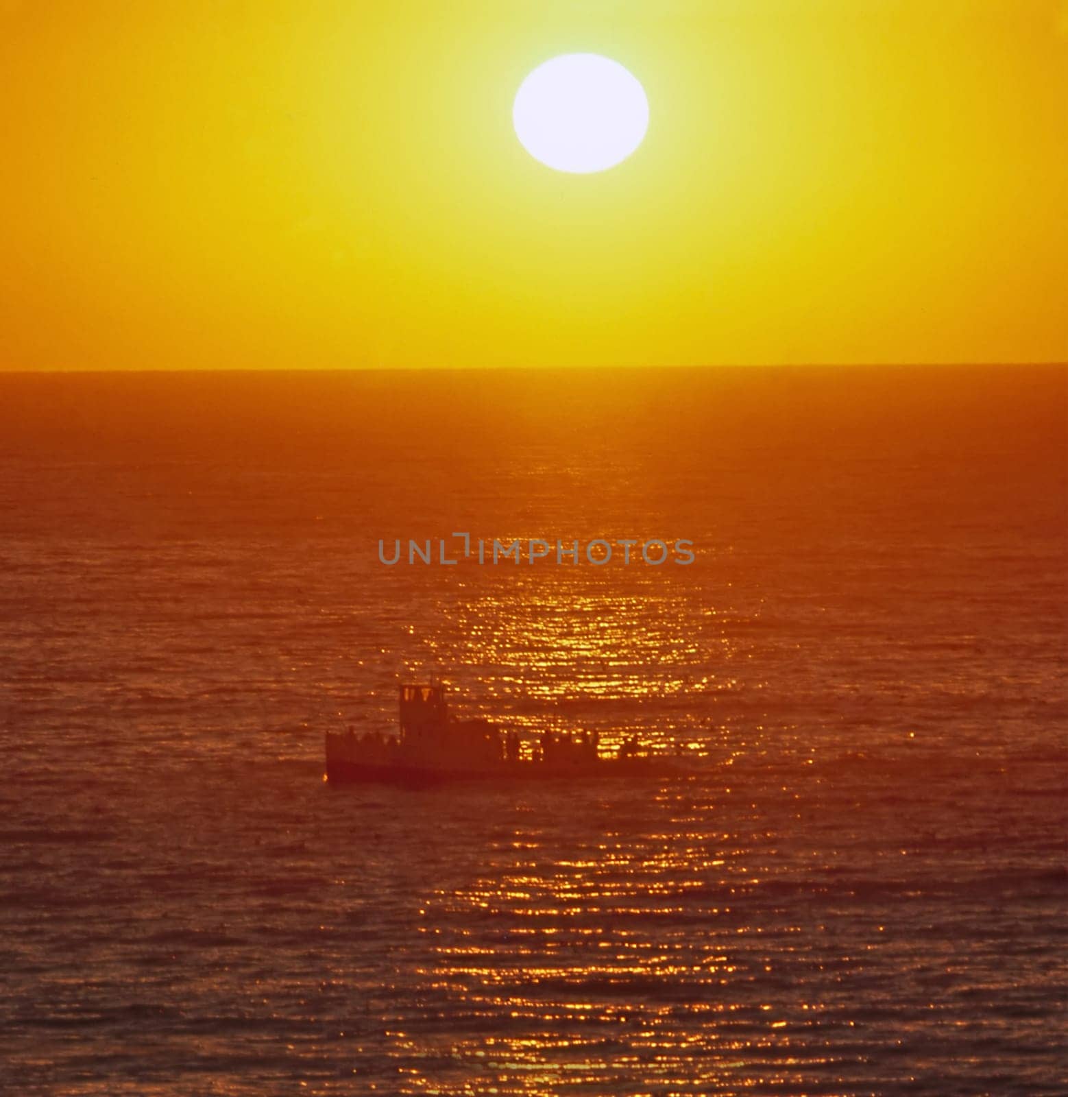 Pacific Ocean at sunset with boat