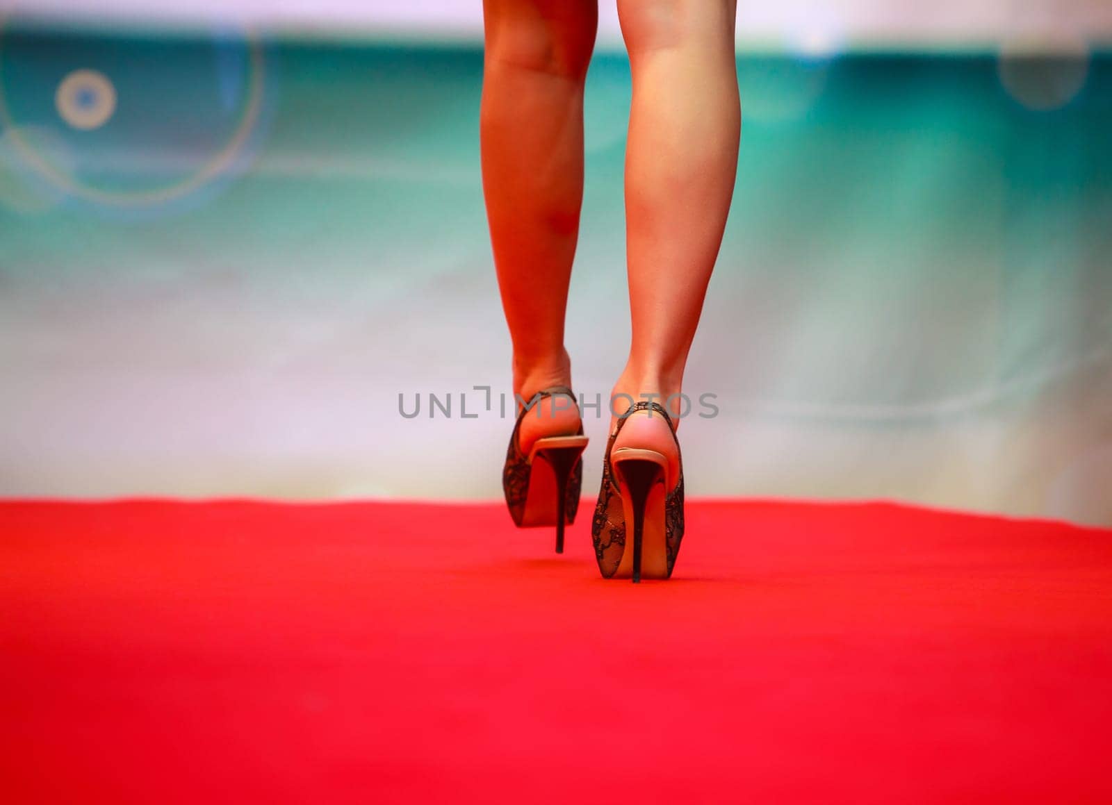 Model walking on runway during fashion show