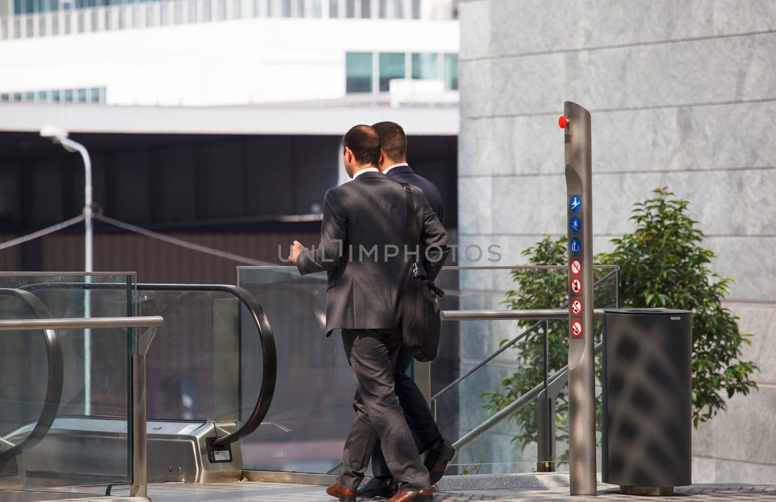 business men walking with travel bag