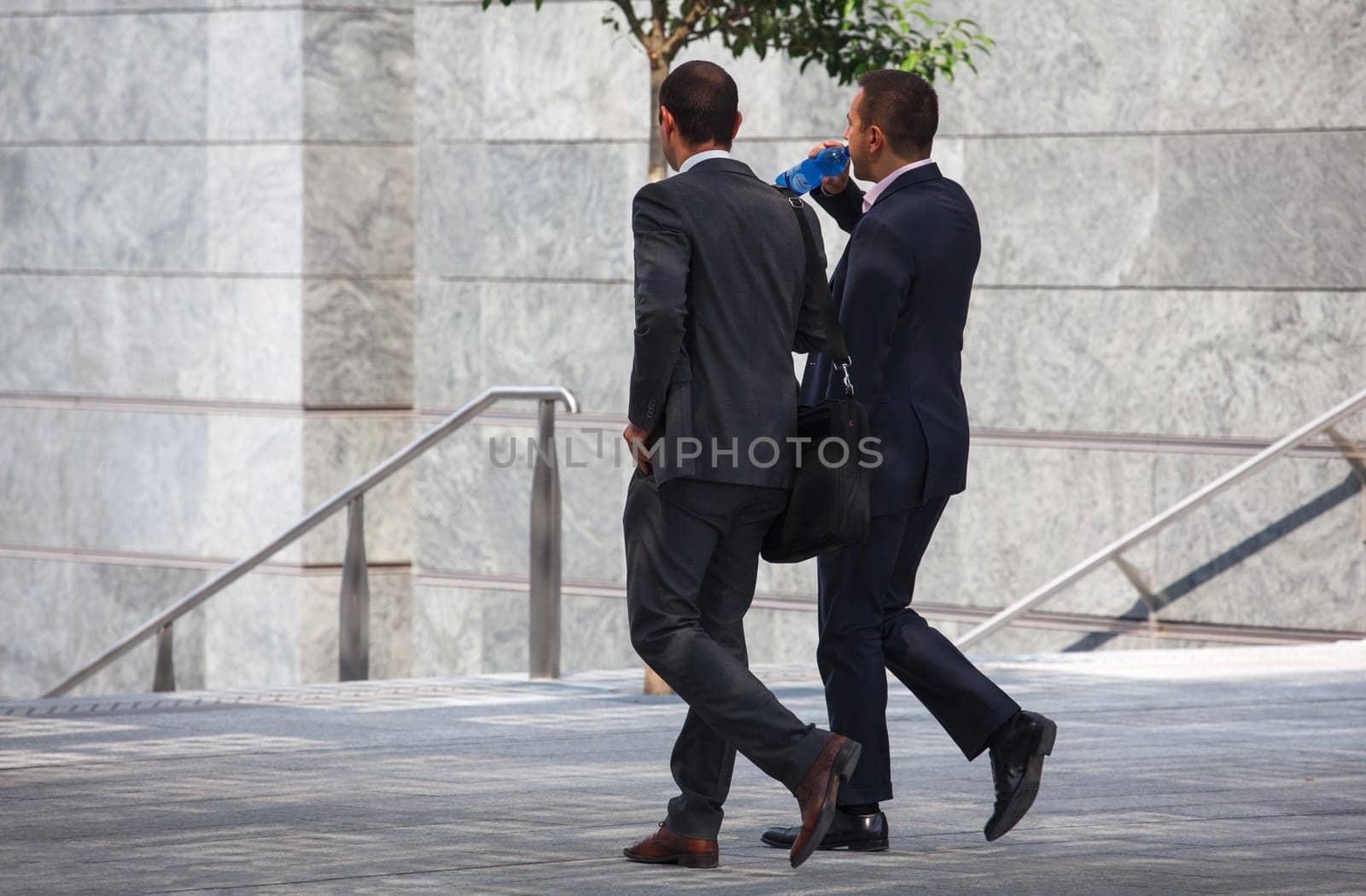 business men walking with travel bag