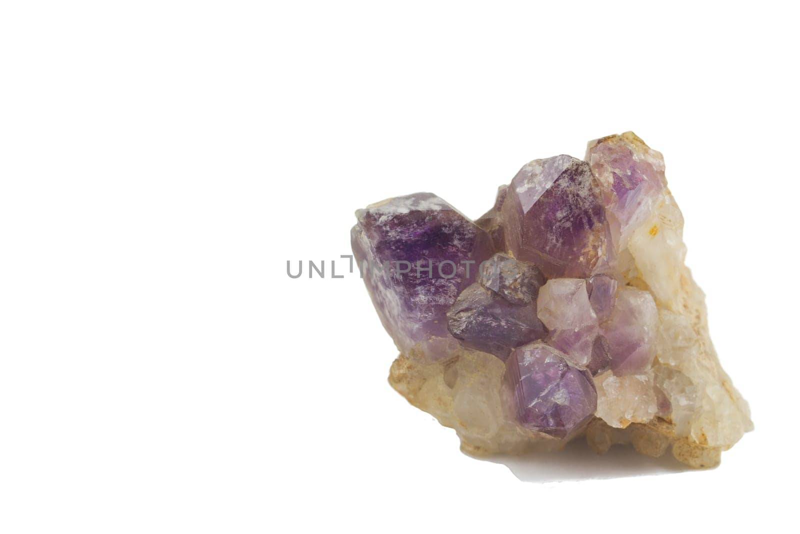 Purple Amethyst crystals isolated on a white background