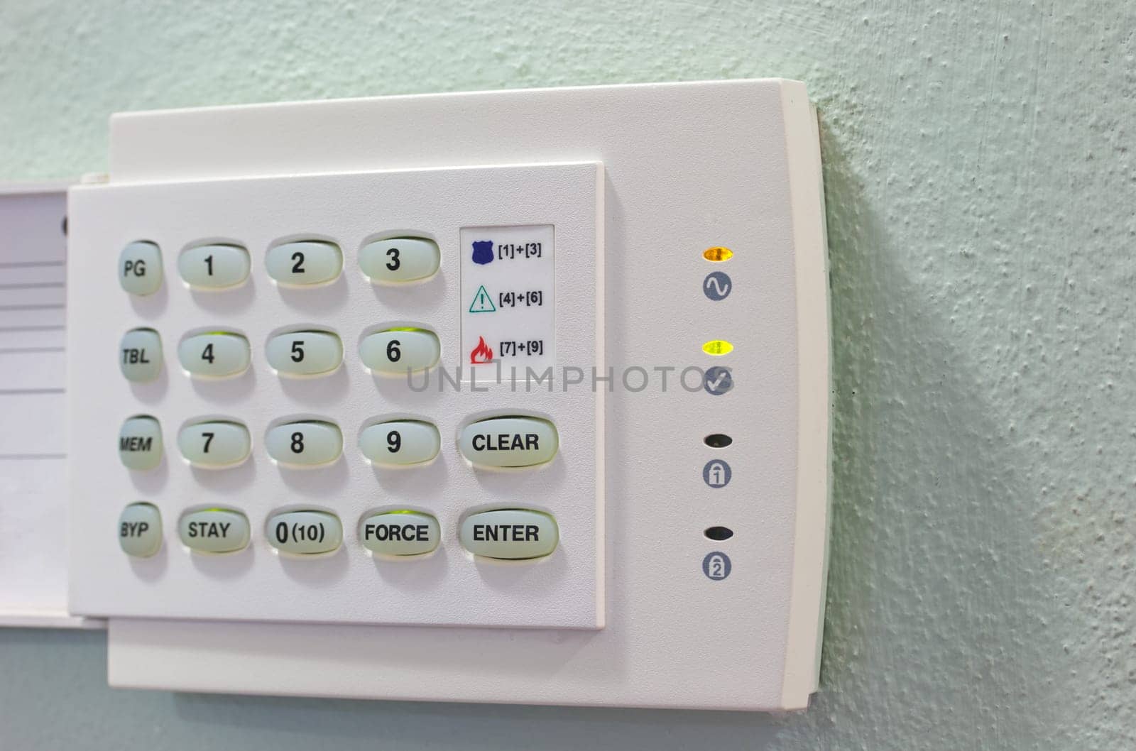 Security Appliances numeric keypad on the green wall