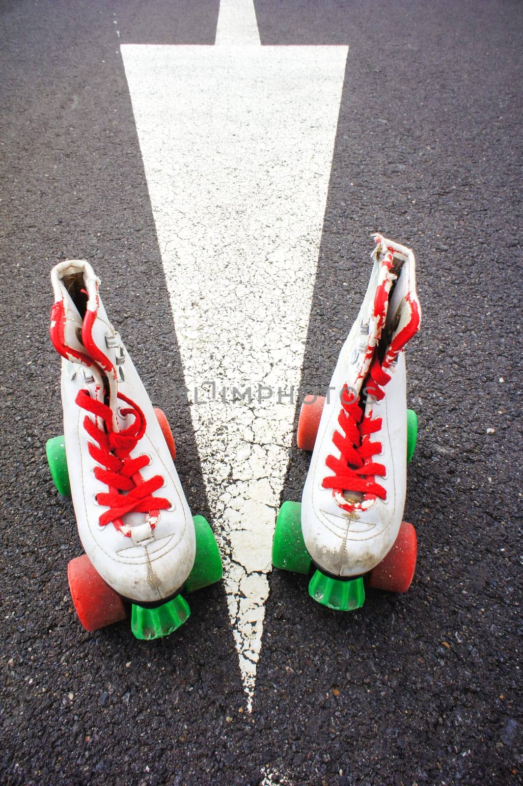 Old Vintage White Skate Boot on the Asphalt Sterret