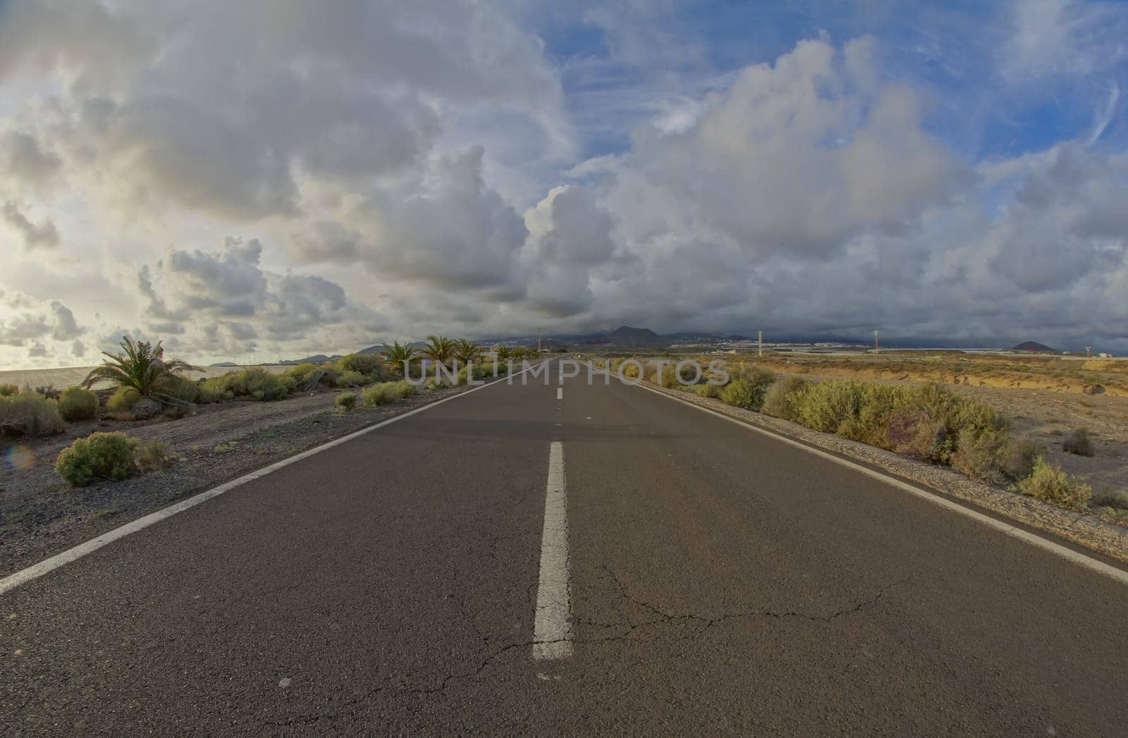Long Empty Desert Road on a Cludy Day