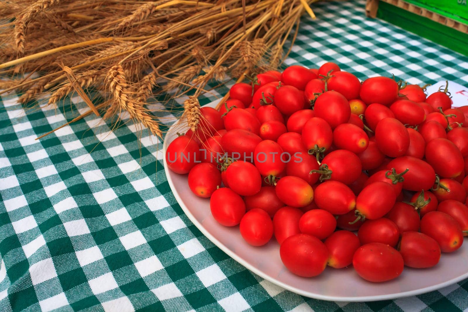 View of Wheat and tomatoes on tablecloth