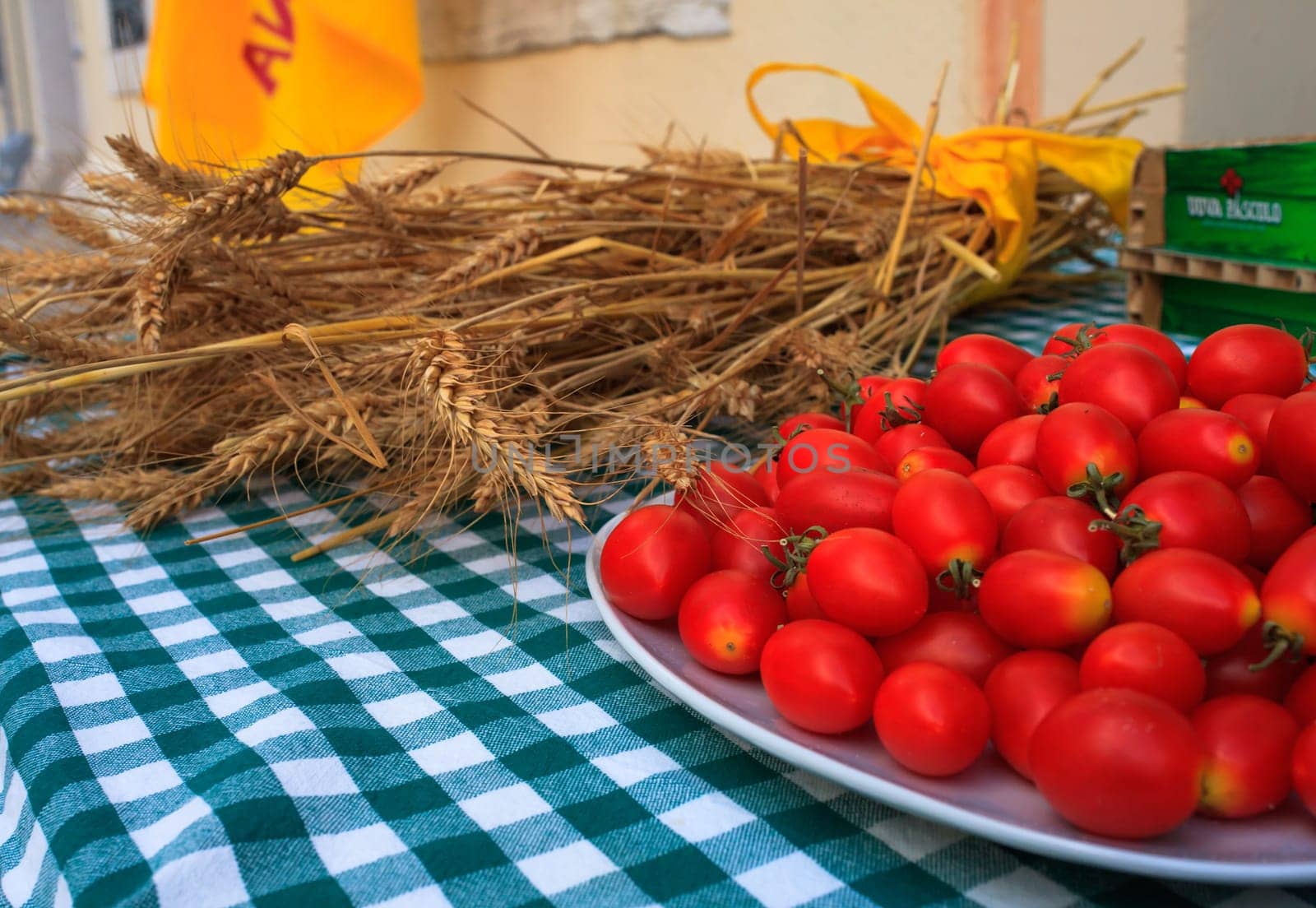 View of Wheat and tomatoes on tablecloth