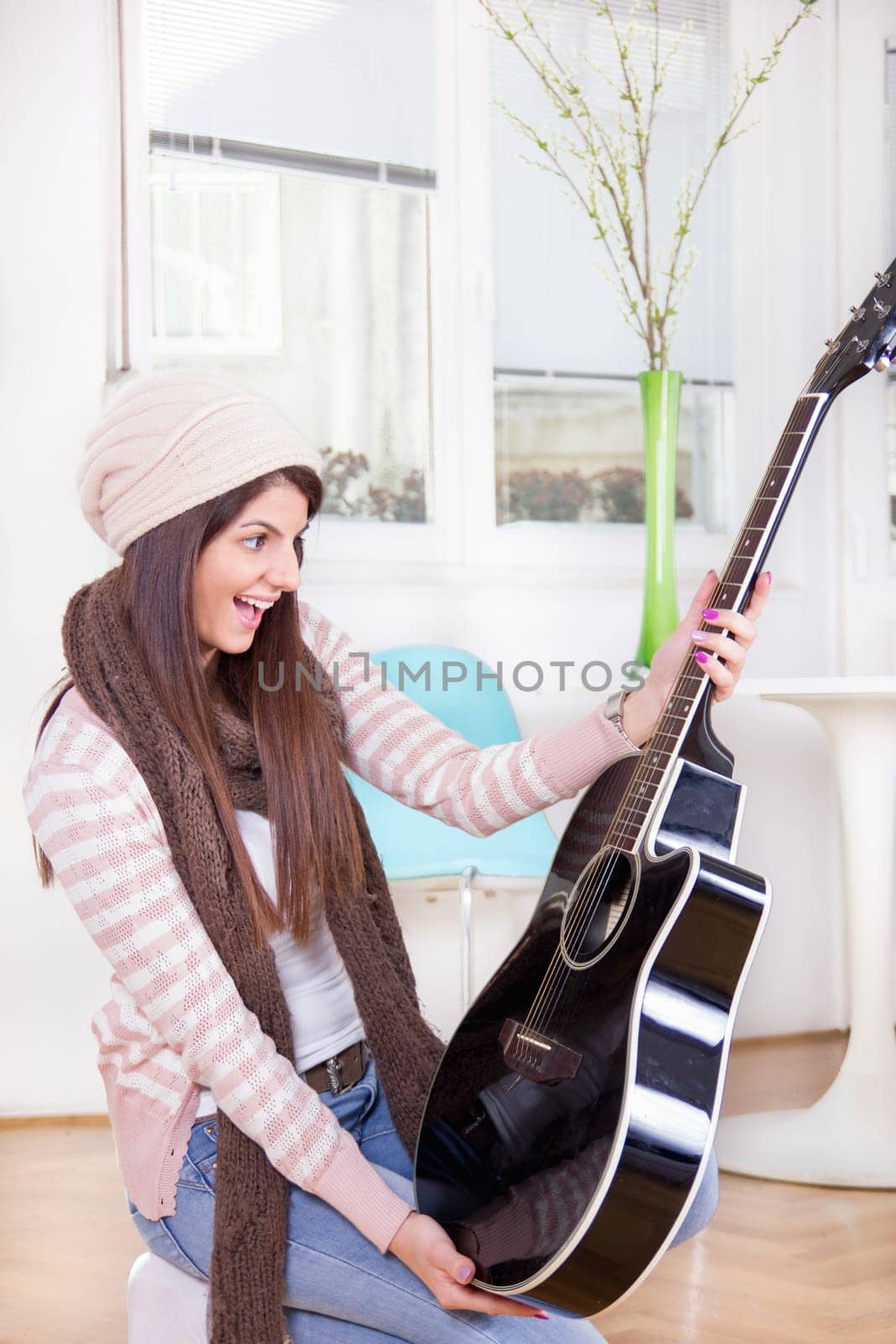 cute girl gets guitar as a present