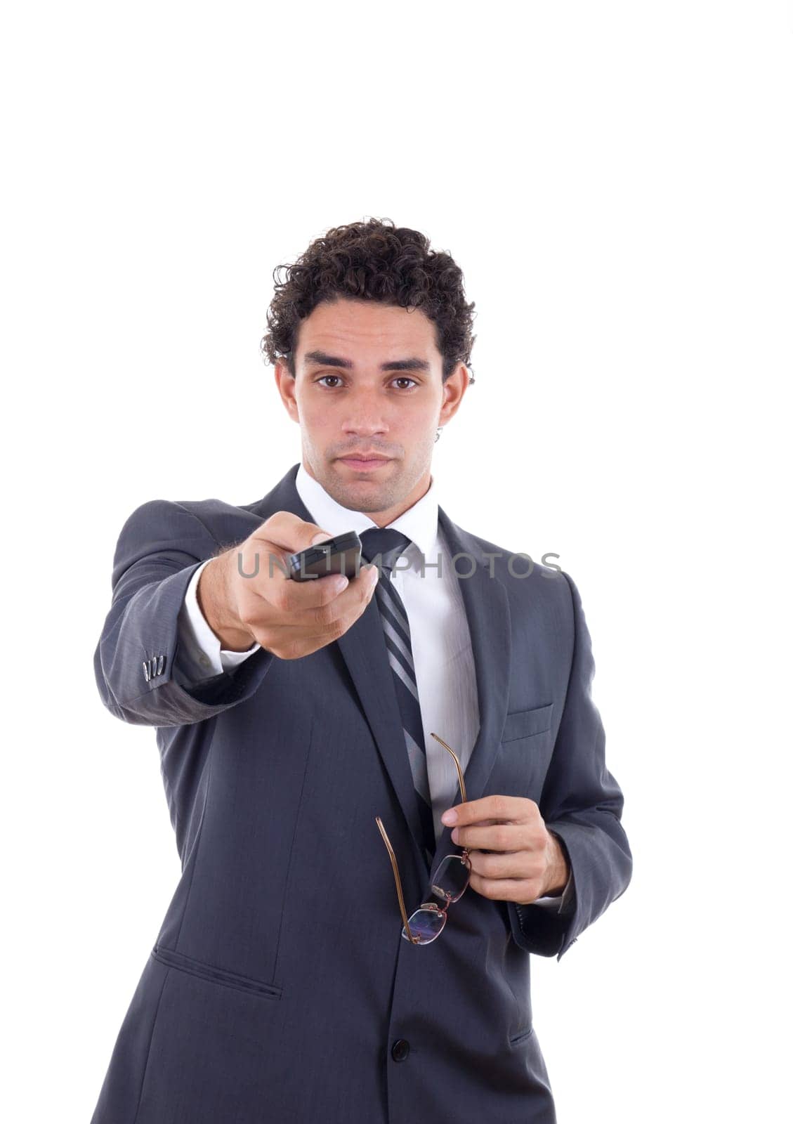 Adult man in suit holding galsess and changing channel with remote