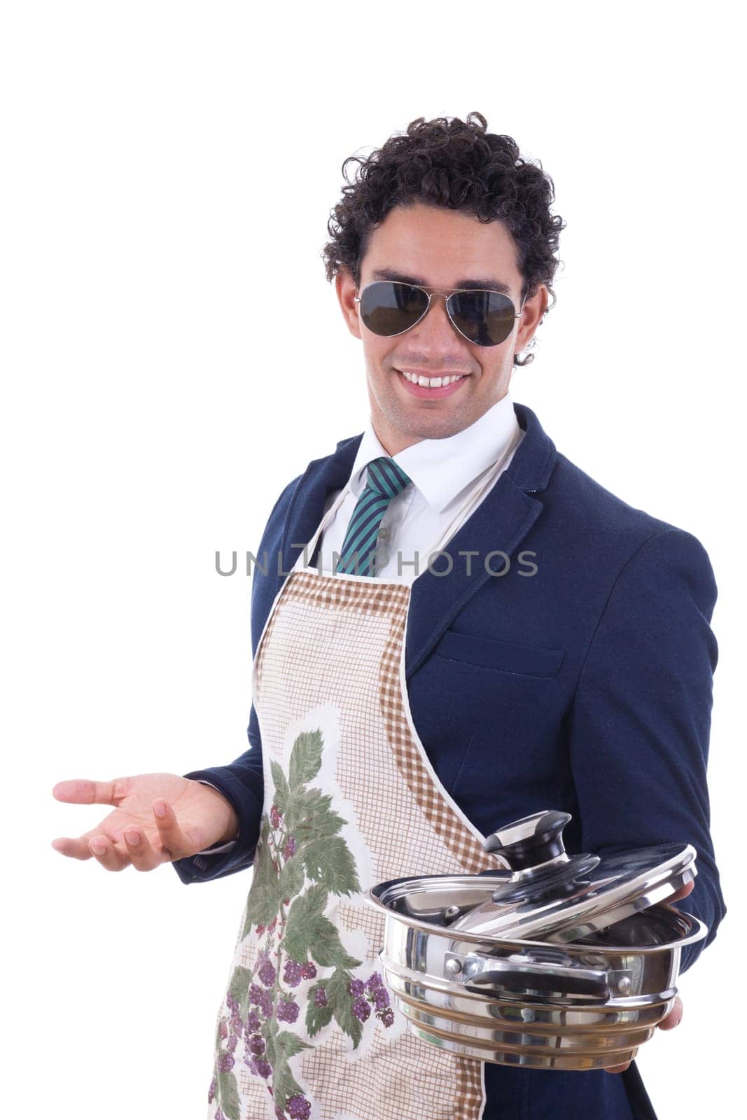 adult smiling man in suit with an apron holding a cooking pot