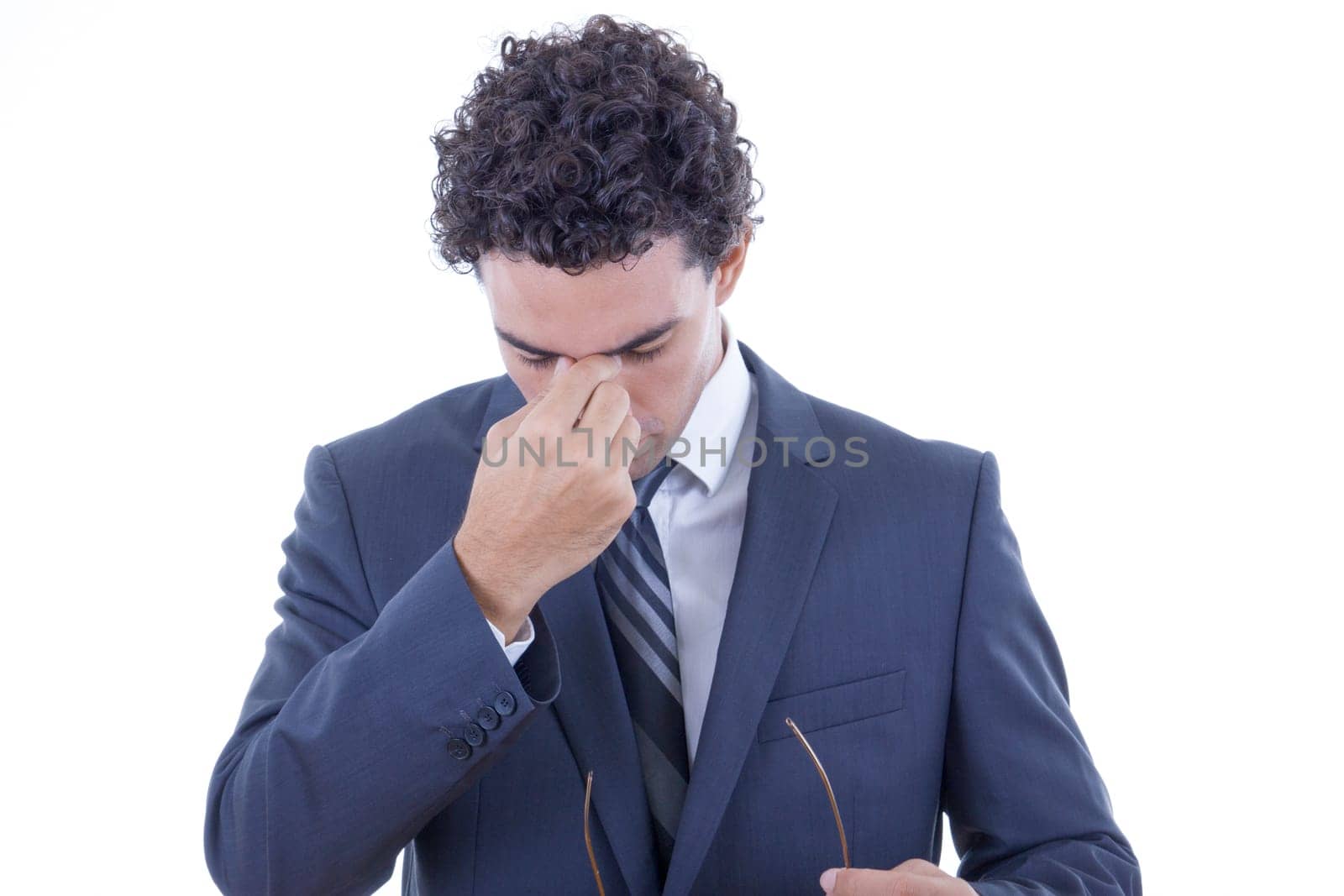 young businessman in suit having hard headache